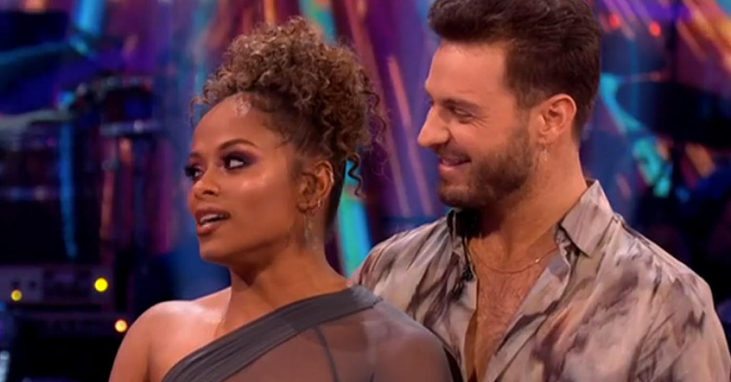 Fleur East smiling on Strictly Come Dancing with her pro partner