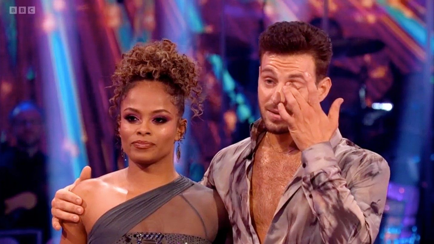 Fleur East smiling on Strictly Come Dancing with her pro partner