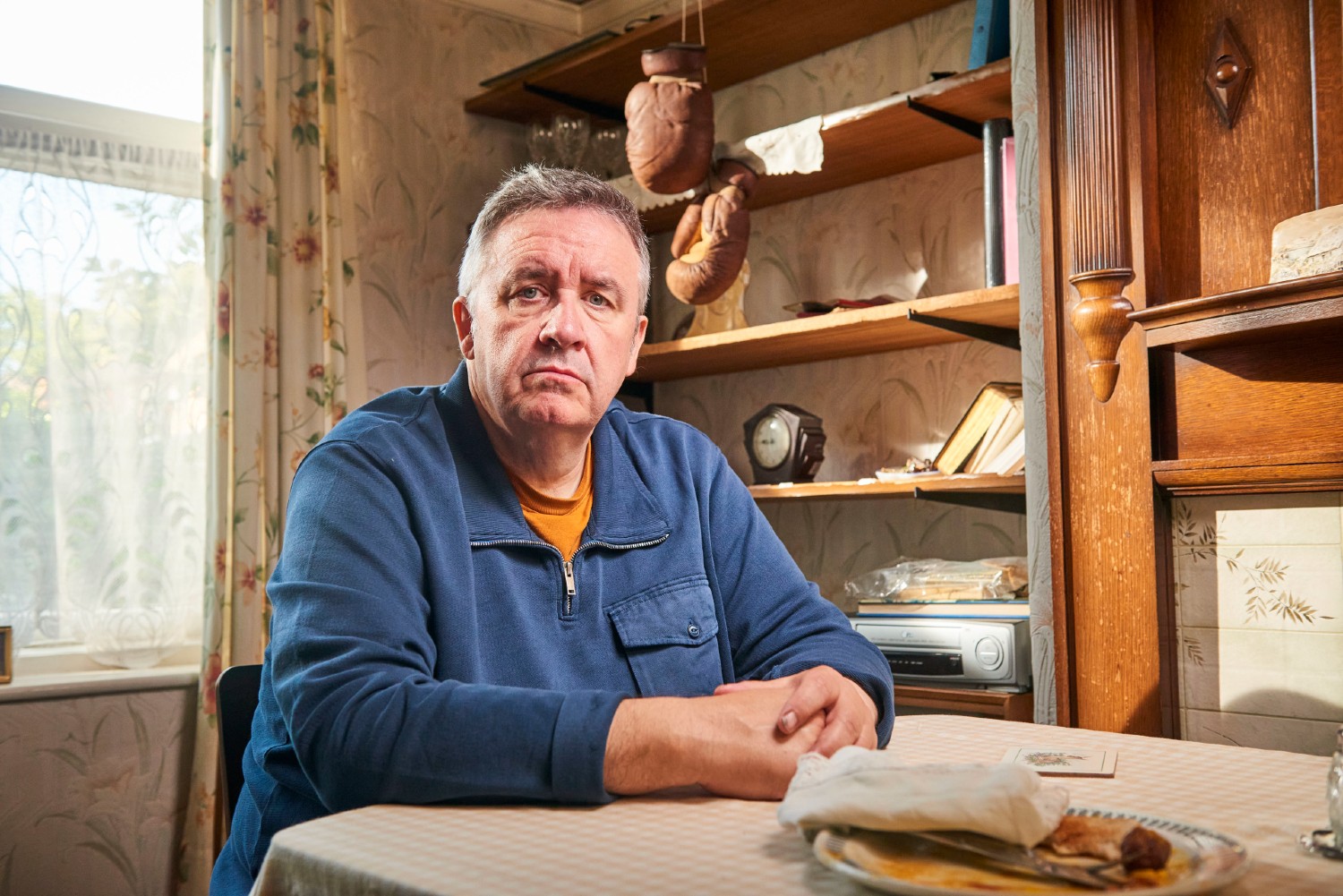 Mark Benton sitting down at a table
