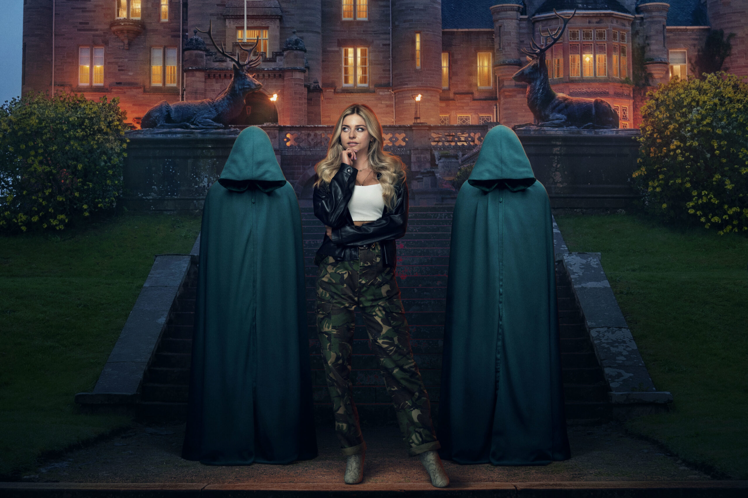 Contestant Alex Gray poses with the two hoods