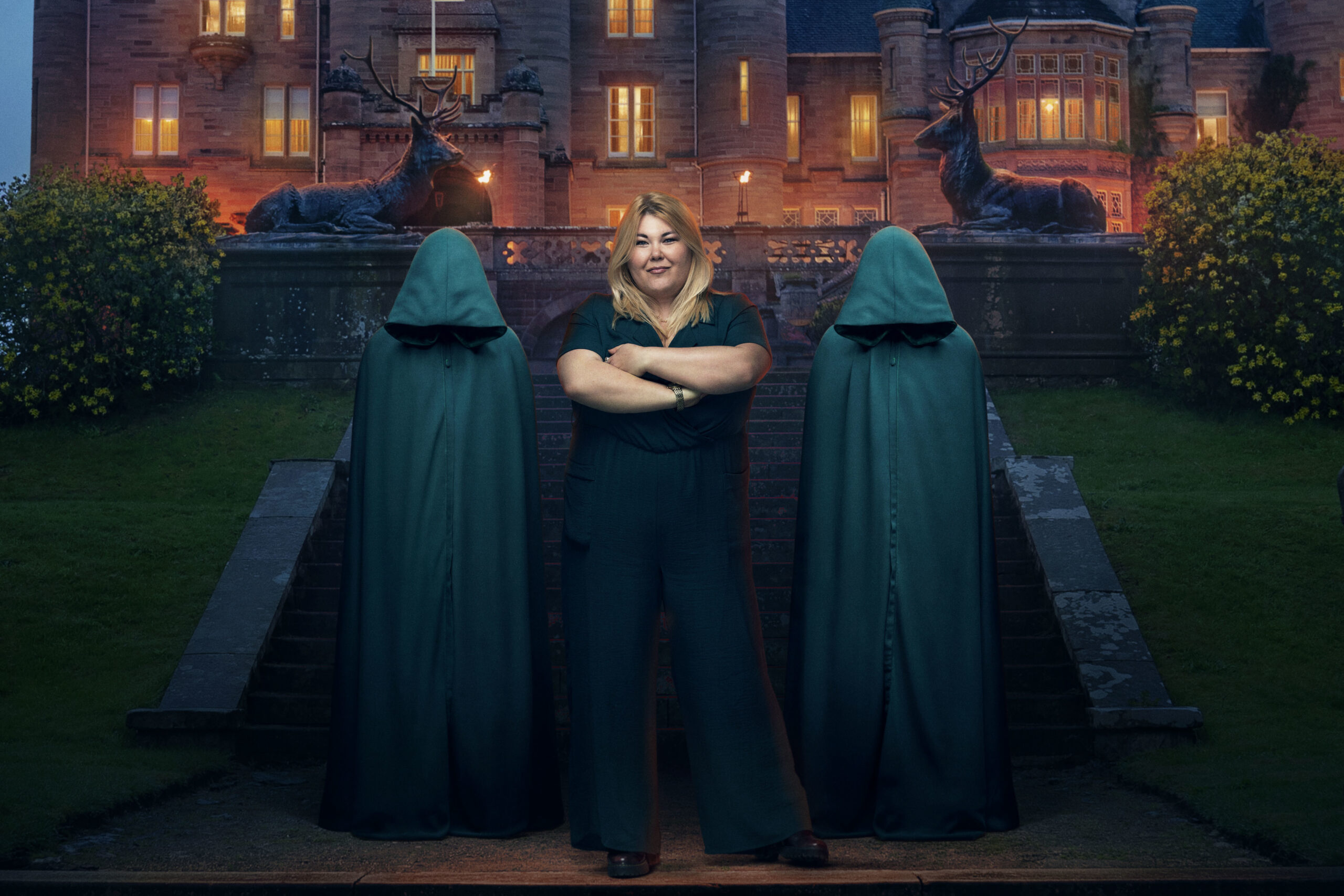 Contestant Hannah folds her arms and smile on The Traitors