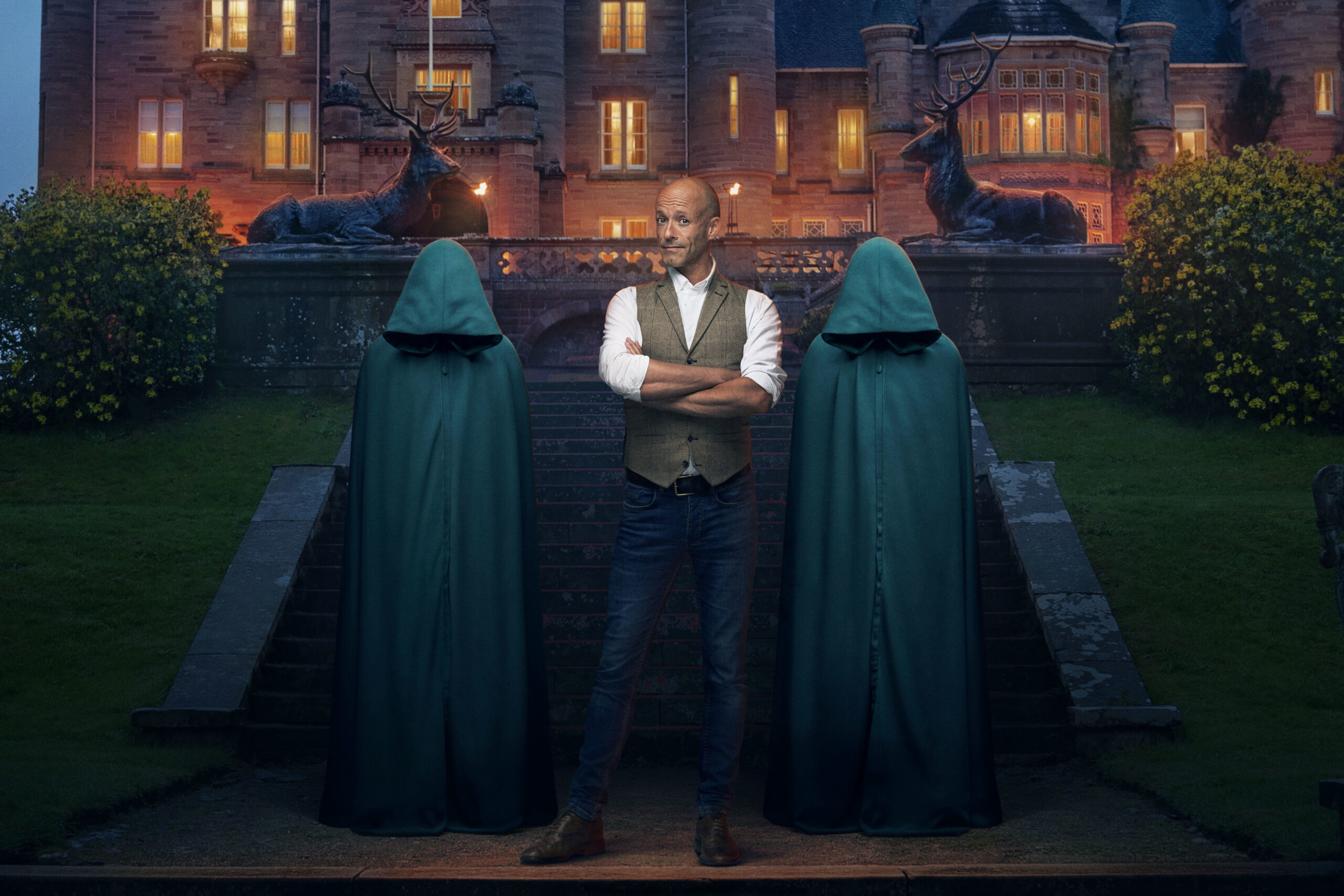 John folds his arms between The Traitors