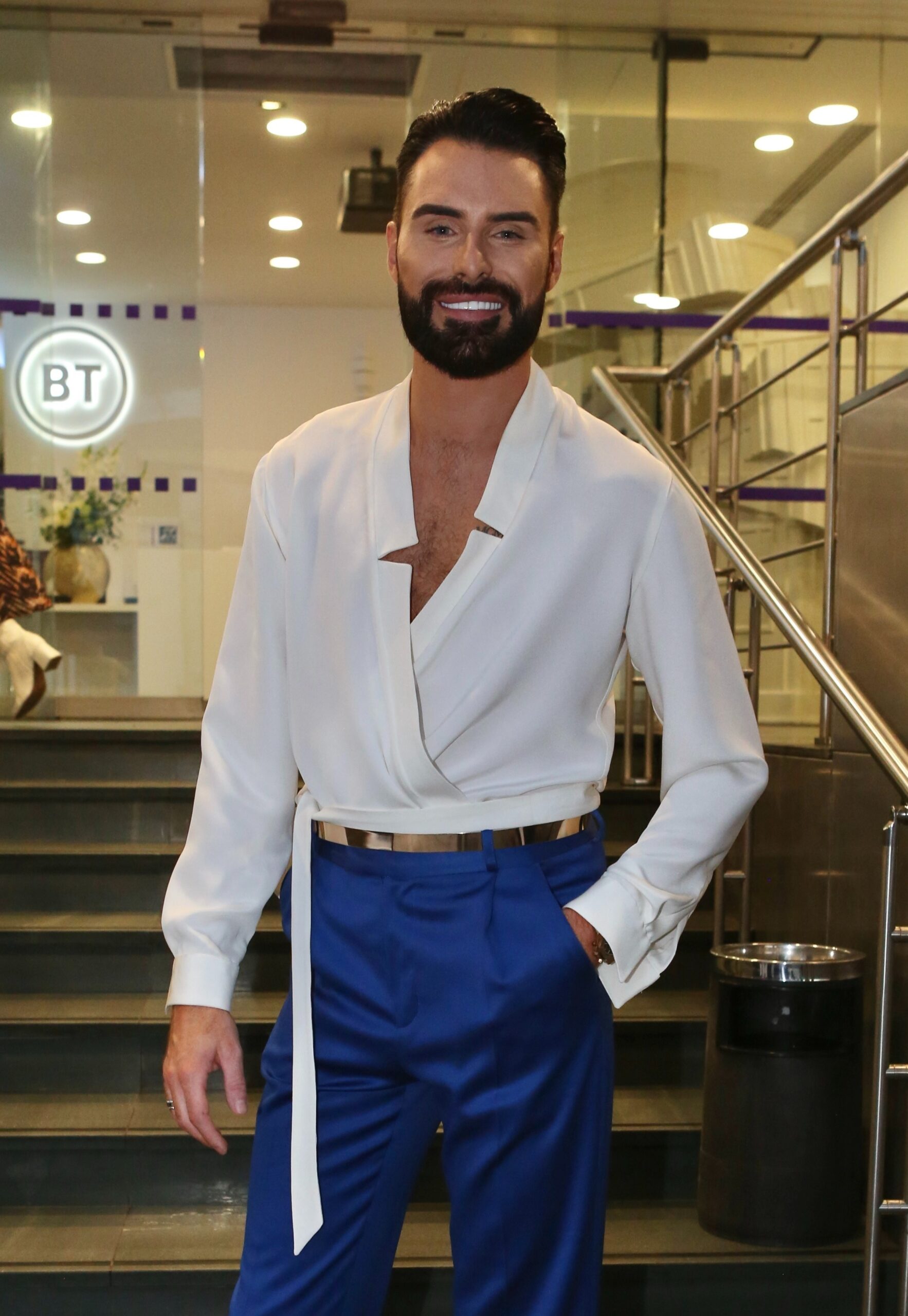 Rylan Clark wearing white and smiling
