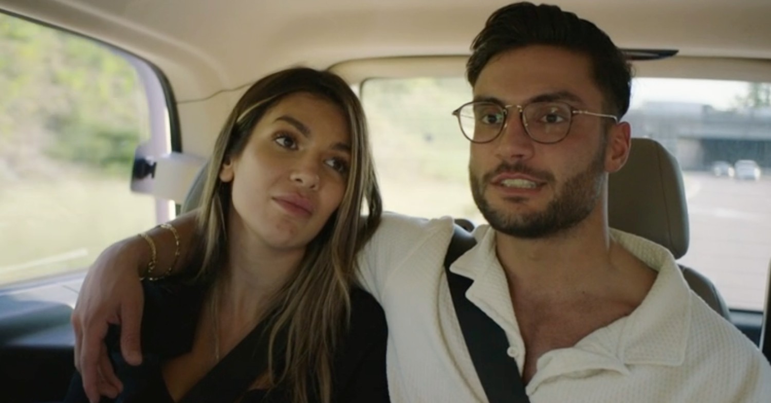 Ekin-Su and Davide in the back of a car in their new show, Homecomings 