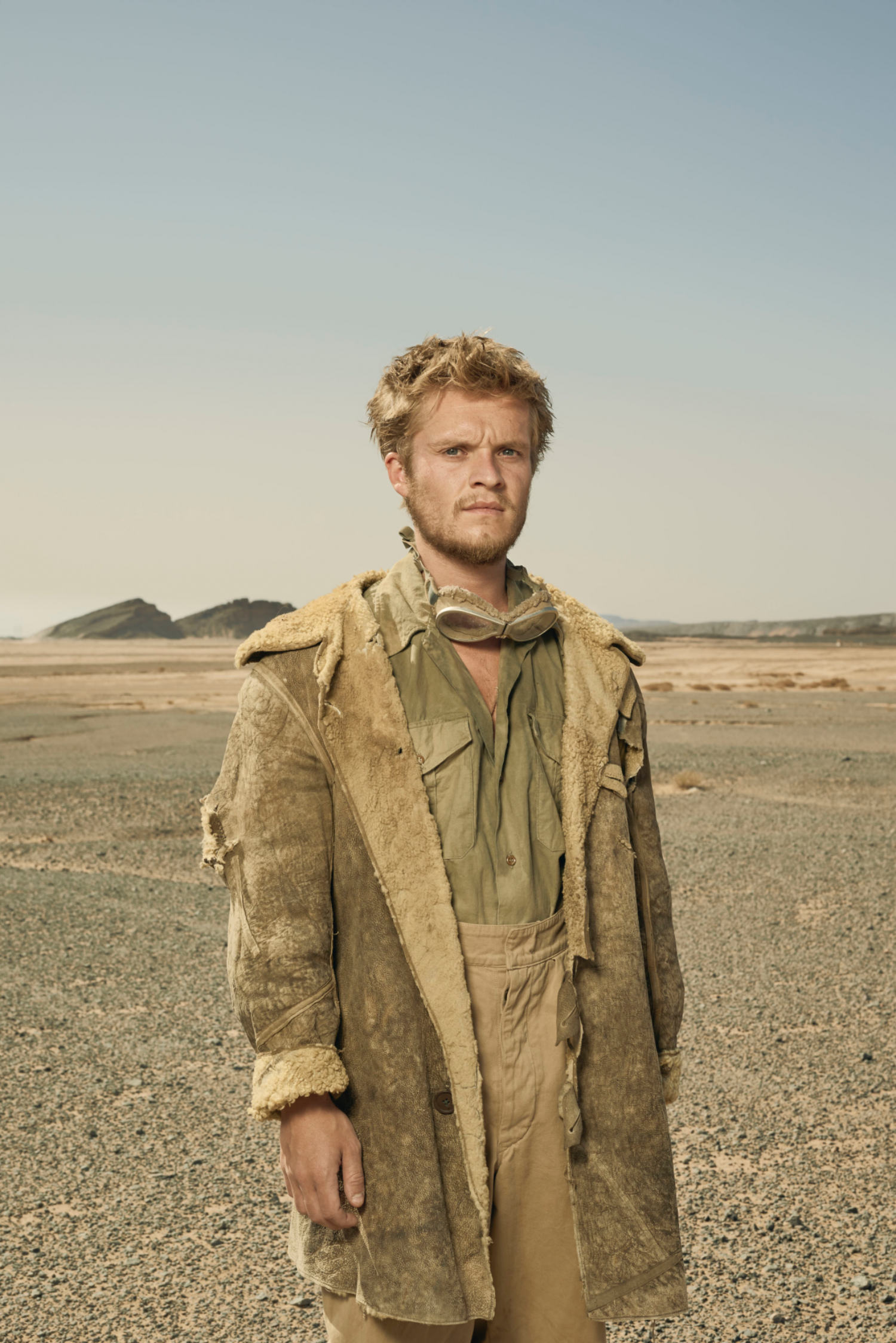 Tom Glynn-Carney posing in the desert in SAS Rogue Heroes
