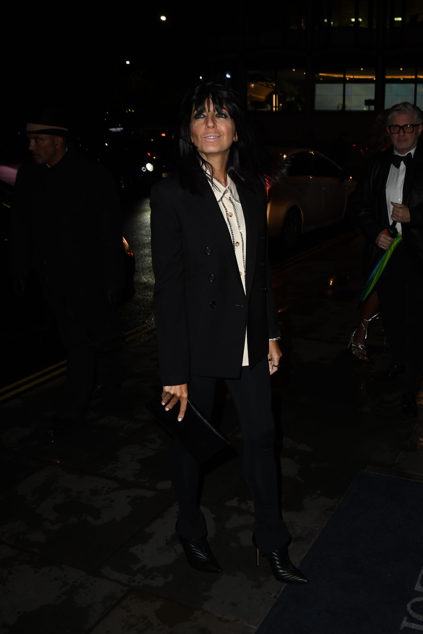 Claudia Winkleman wearing black and smiling