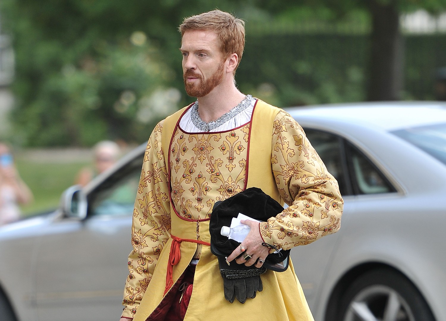 Damian Lewis in costume as Henry VIII on set in Wolf Hall