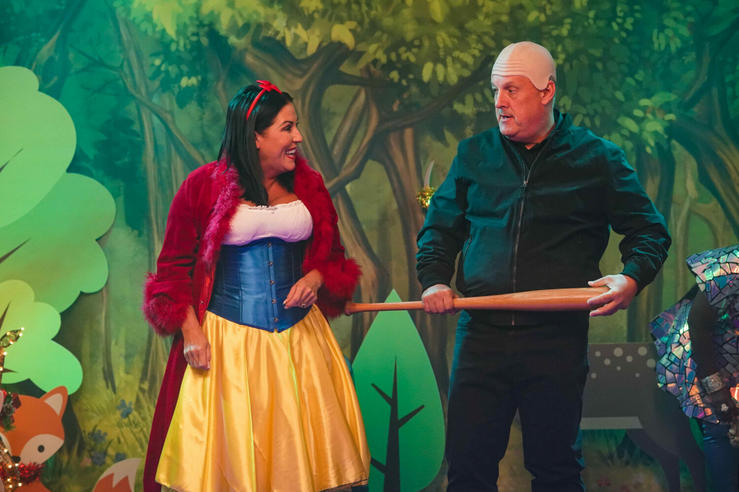 Kat Slater in EastEnders laughs dressed as Snow White with Harvey as the woodcutter