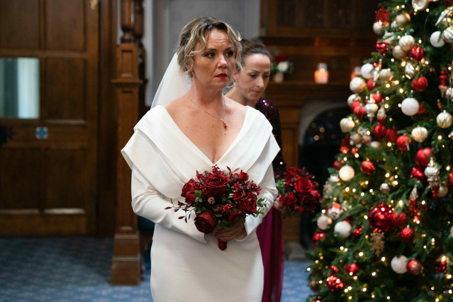 EastEnders' Janine is wearing a wedding dress whilst holding a bouquet