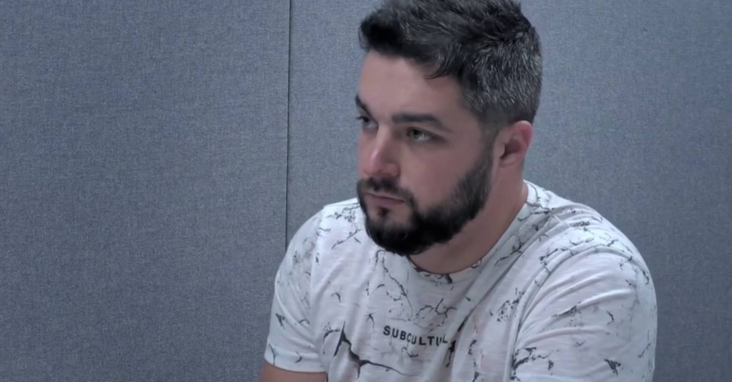 Adam White shown speaking with police officers during 24 Hours In Police Custody