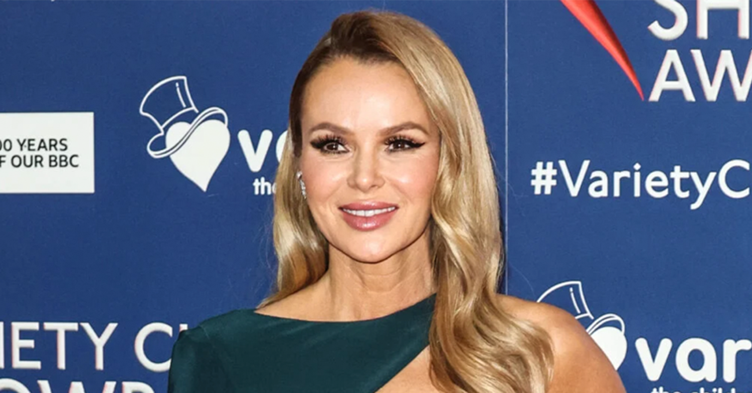 Amanda Holden smiling wearing green