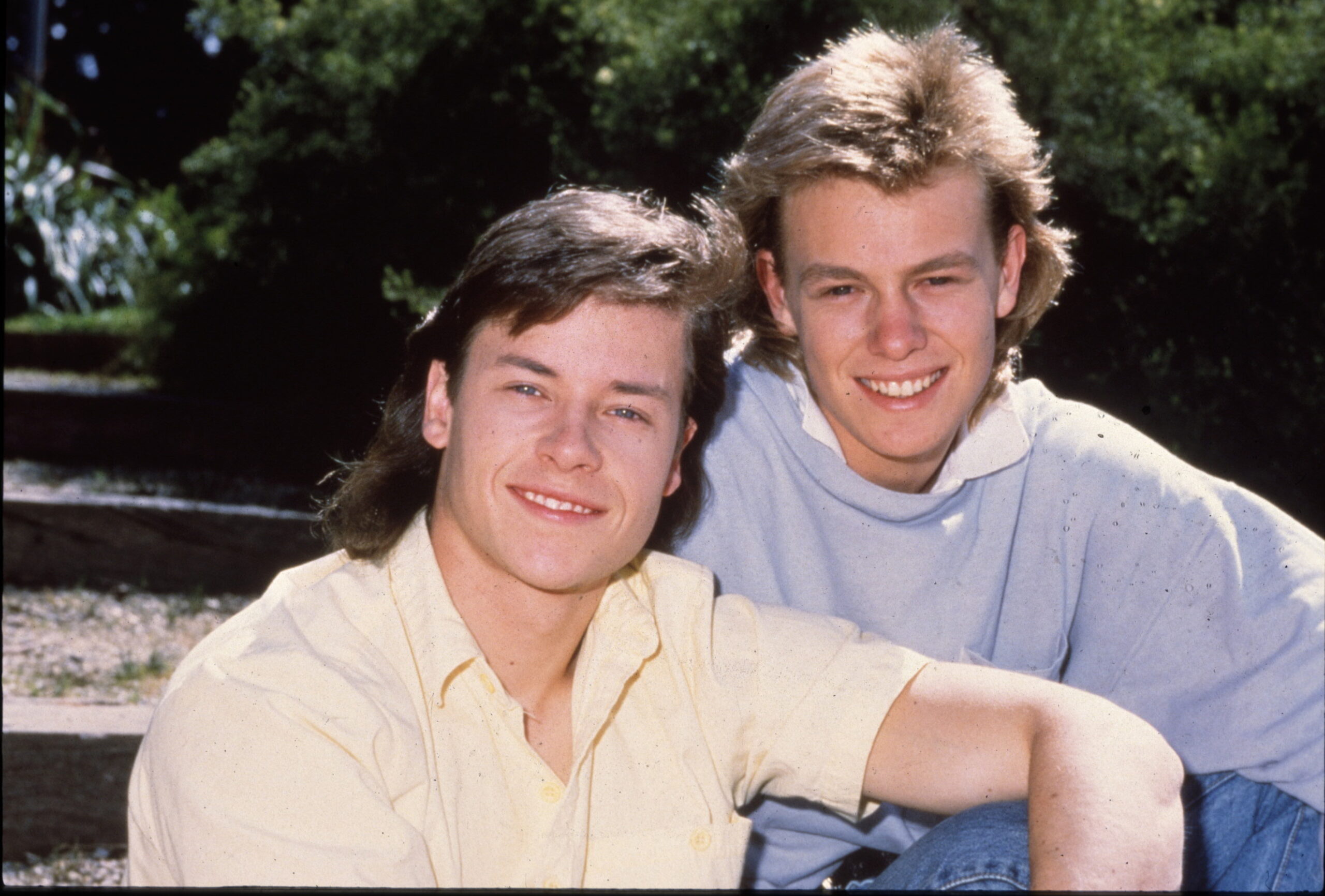 Mike Young and Scott Robinson pose in yellow t-shirt and blue hoodie respectively