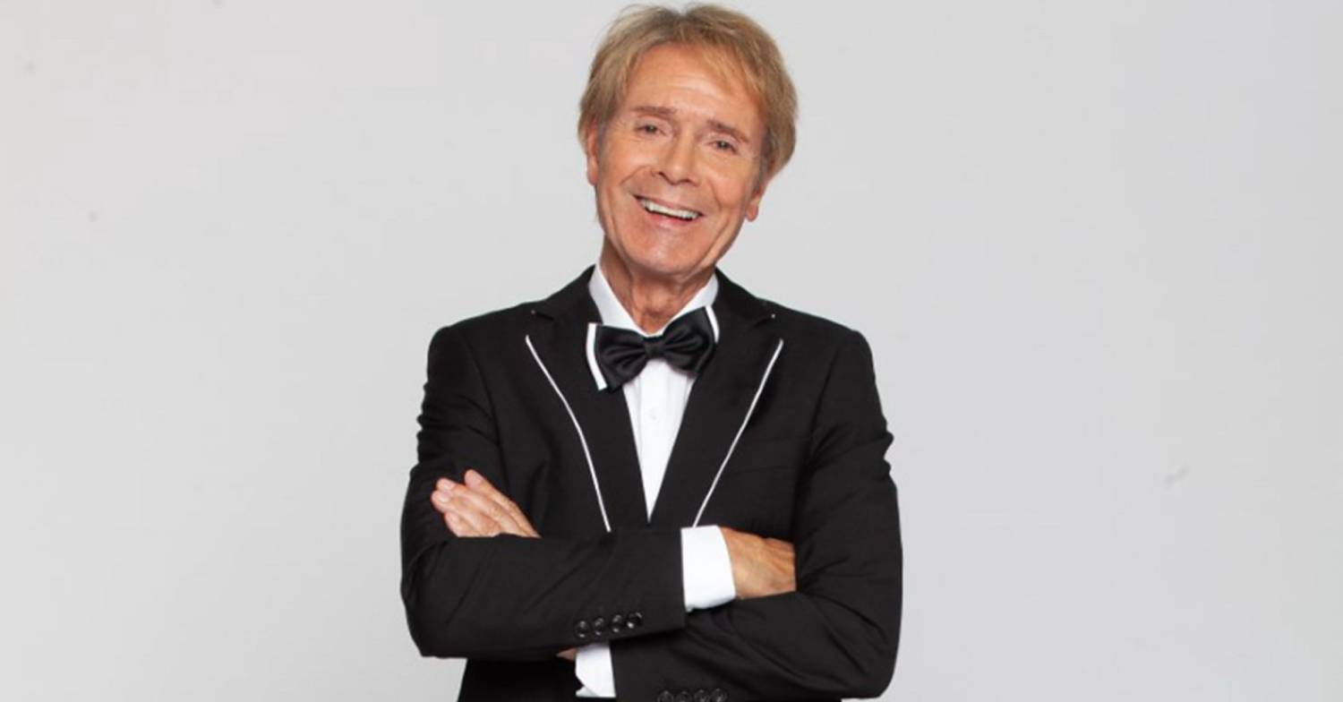 Cliff Richard crosses his arms