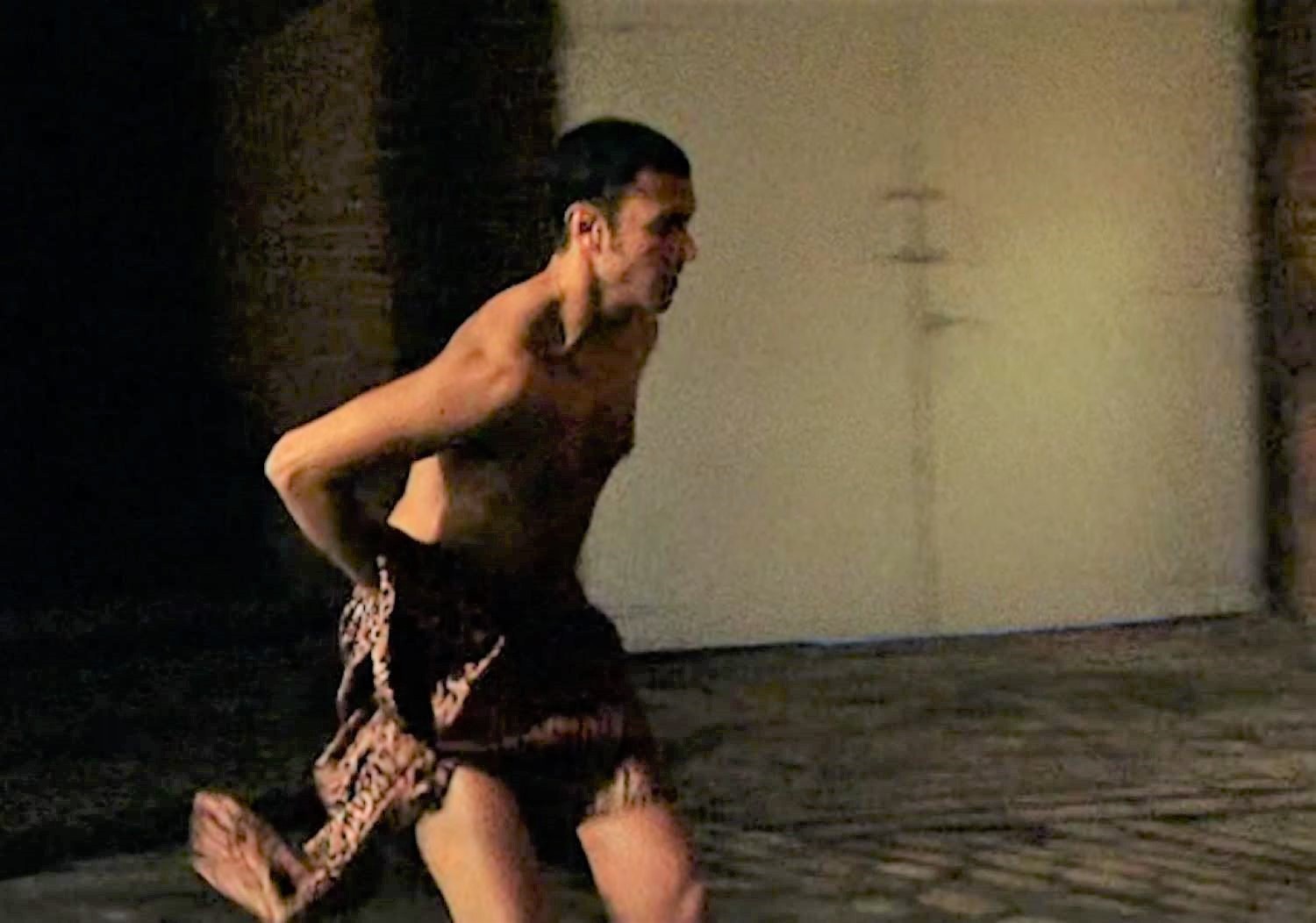 Naked Vikram runs onto the Coronation Street cobbles with just a coat to cover his modesty