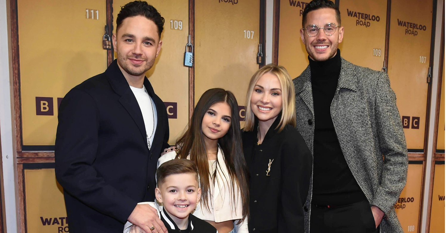 Waterloo Road's Adam is posing at a press event with his family Scarlett, Teddy, Caroline and Scott