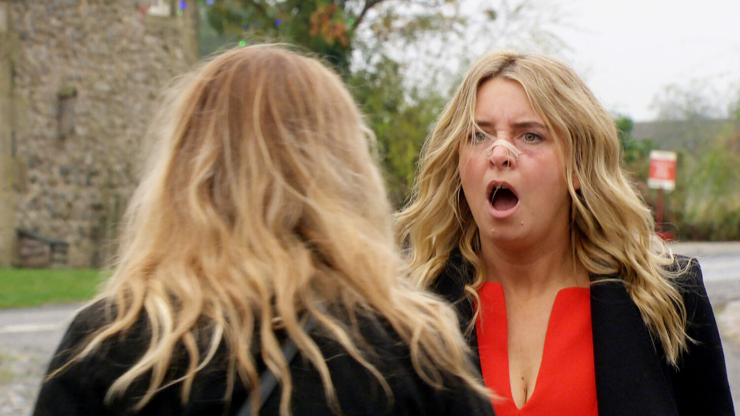 Charity looking shocked at Amy in Emmerdale 