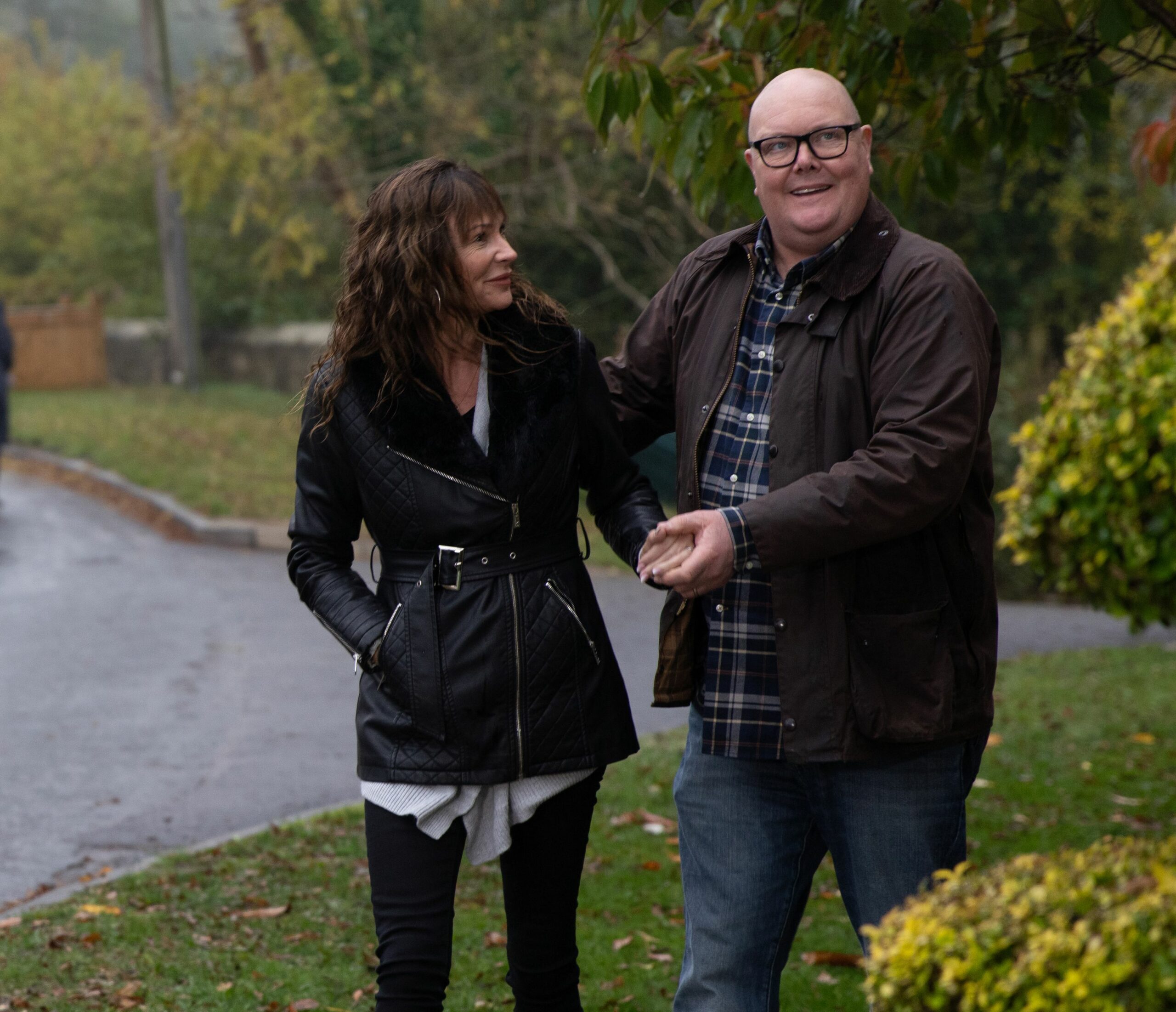 Chas smiling at Paddy as he holds her hand in Emmerdale 