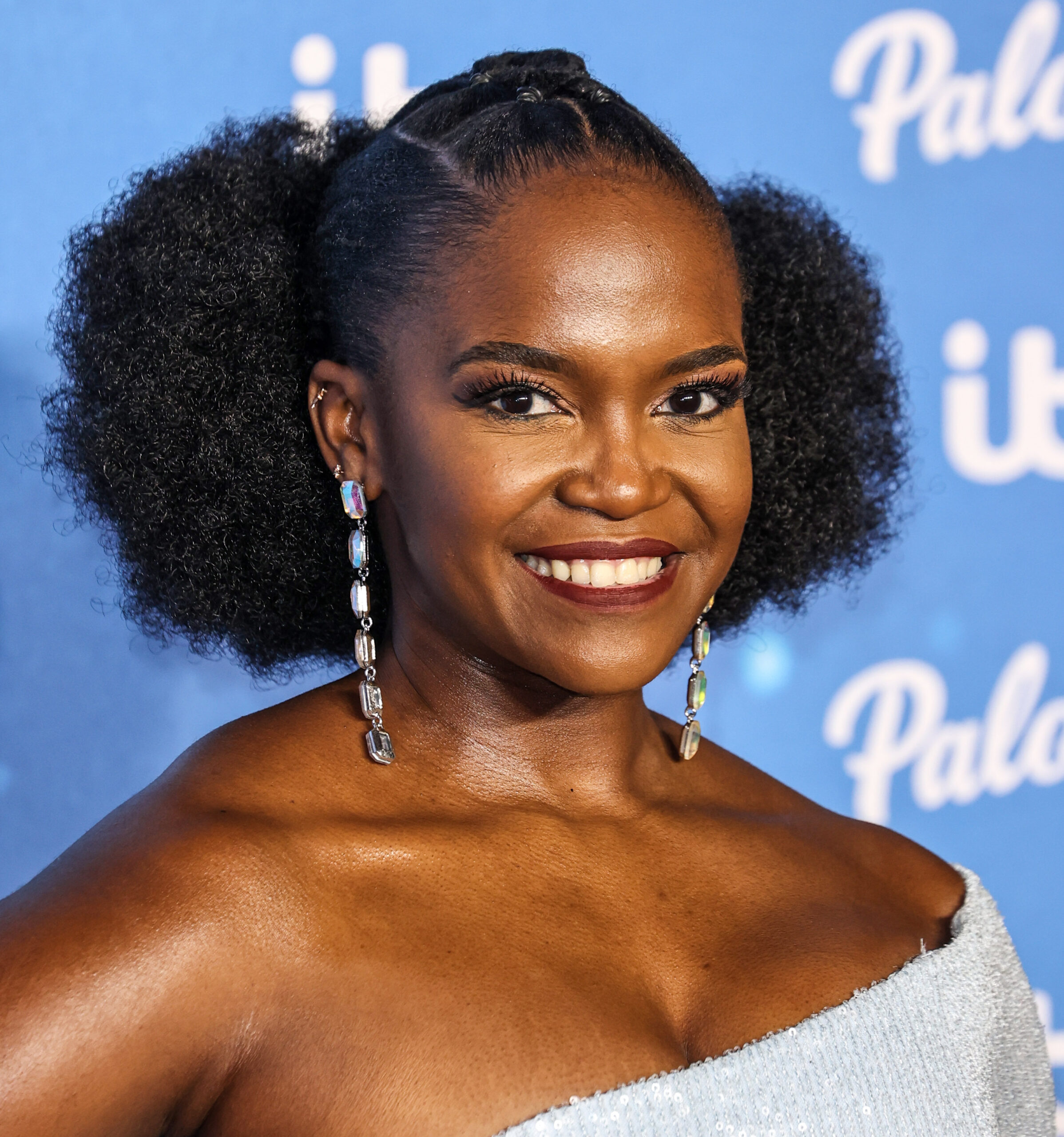 Oti Mabuse smiling on the red carpet