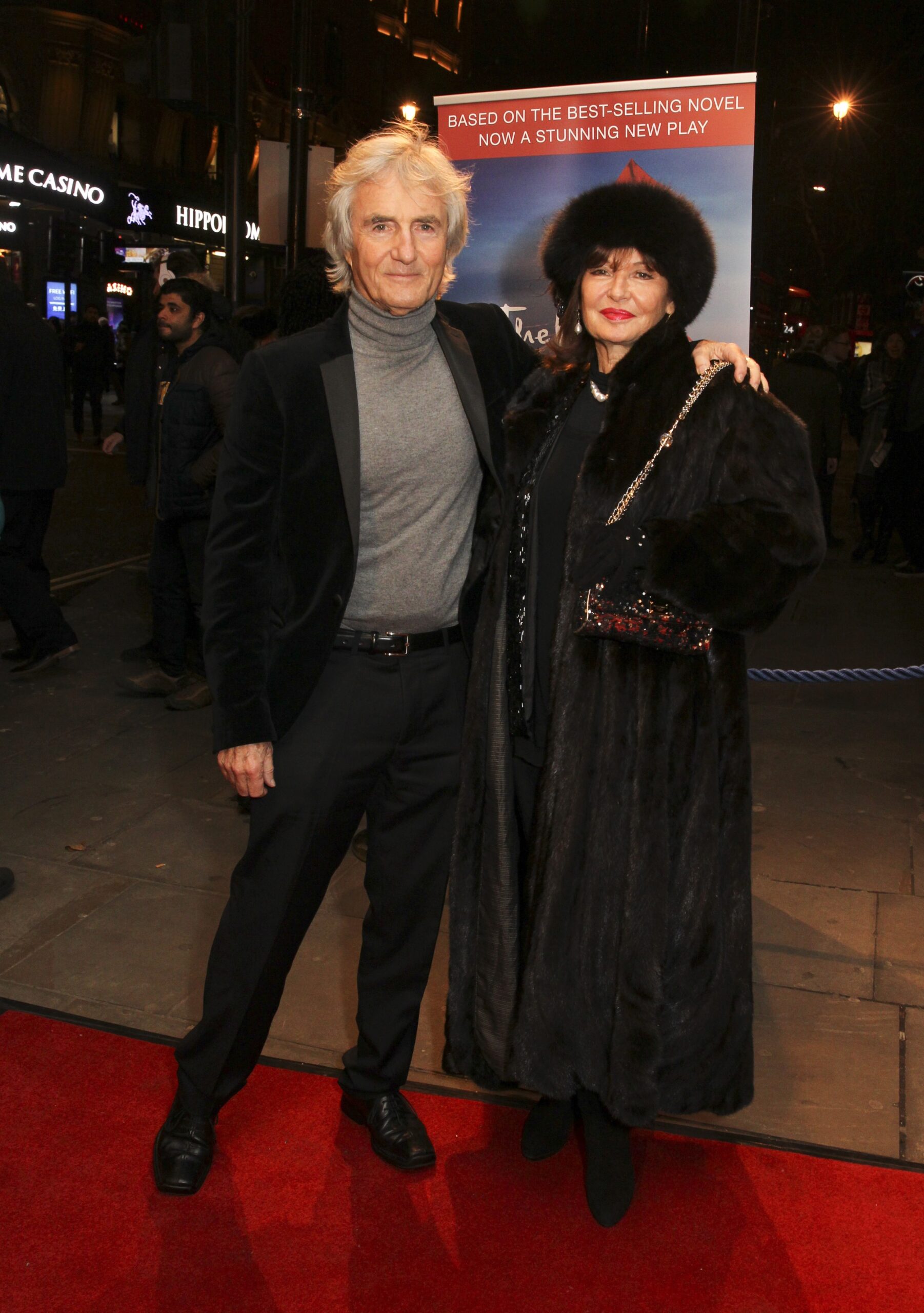Stephanie and Bernie pose on a red carpet together
