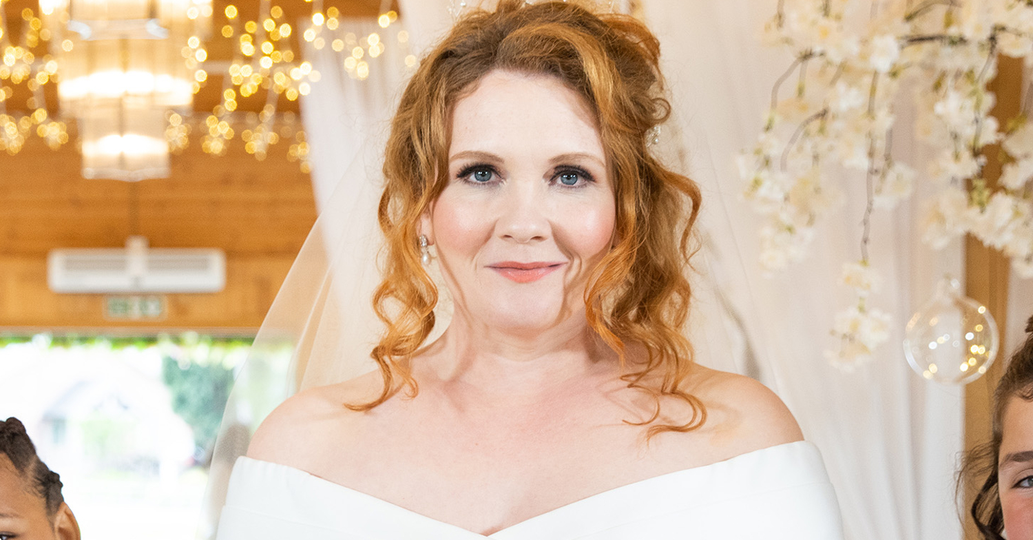 Coronation Street's Fiz is smiling in a wedding dress