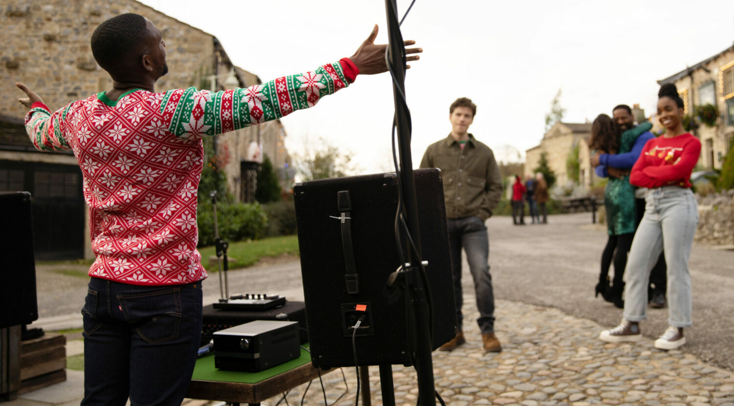 Ethan sets up a sound system in the village and opens his arms to welcome everybody in on Christmas Day in Emmerdale