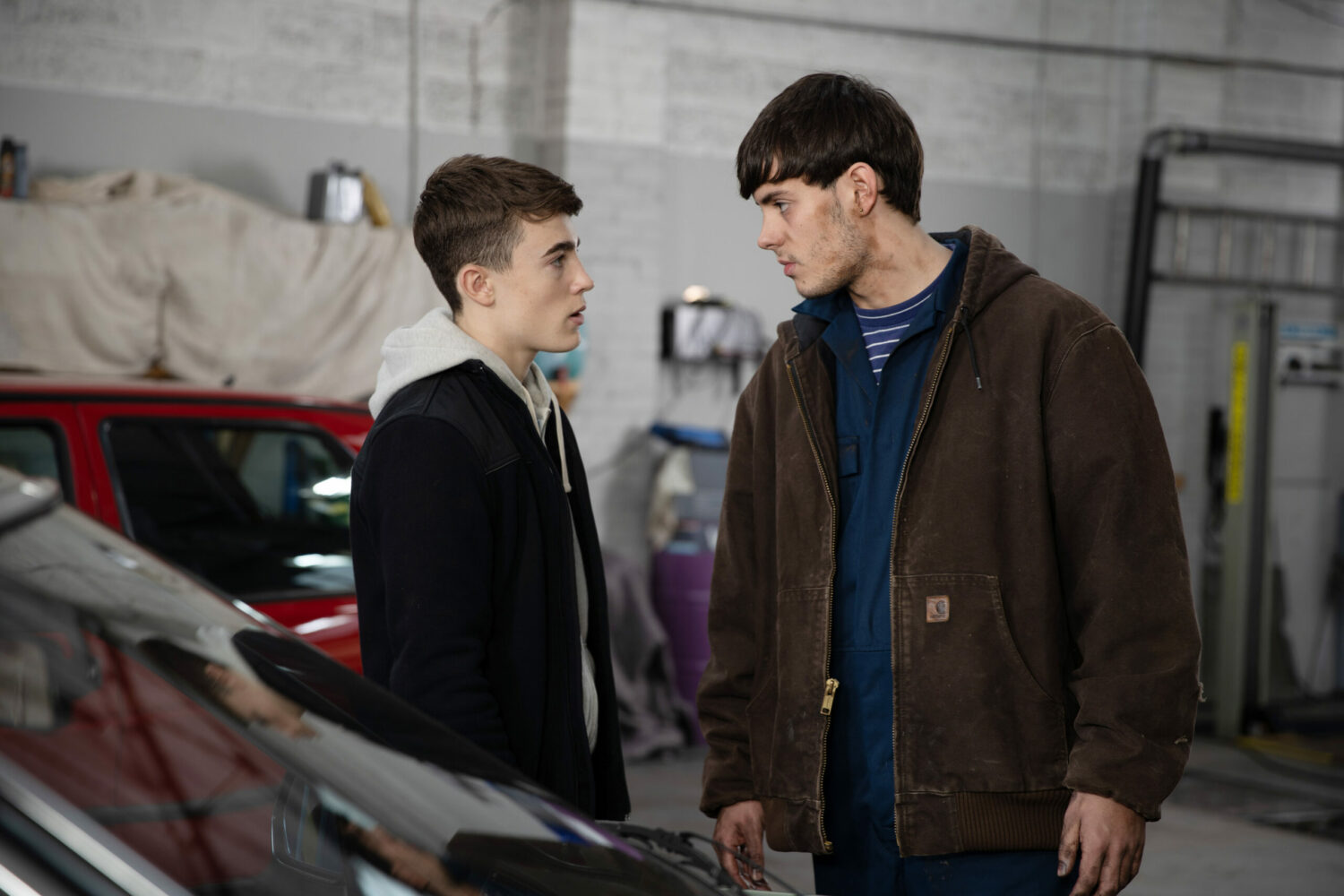 Young Caleb and Cain Dingle glare menacingly at each other on Emmerdale