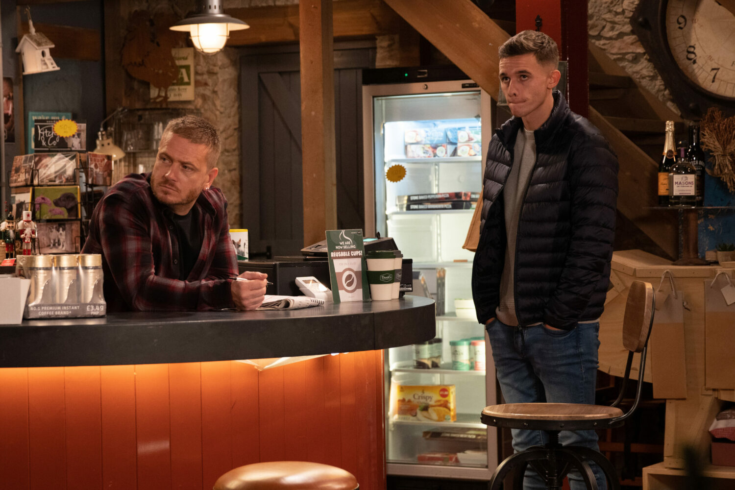 Emmerdale's Jacob looks guilty as David looks upset in the shop