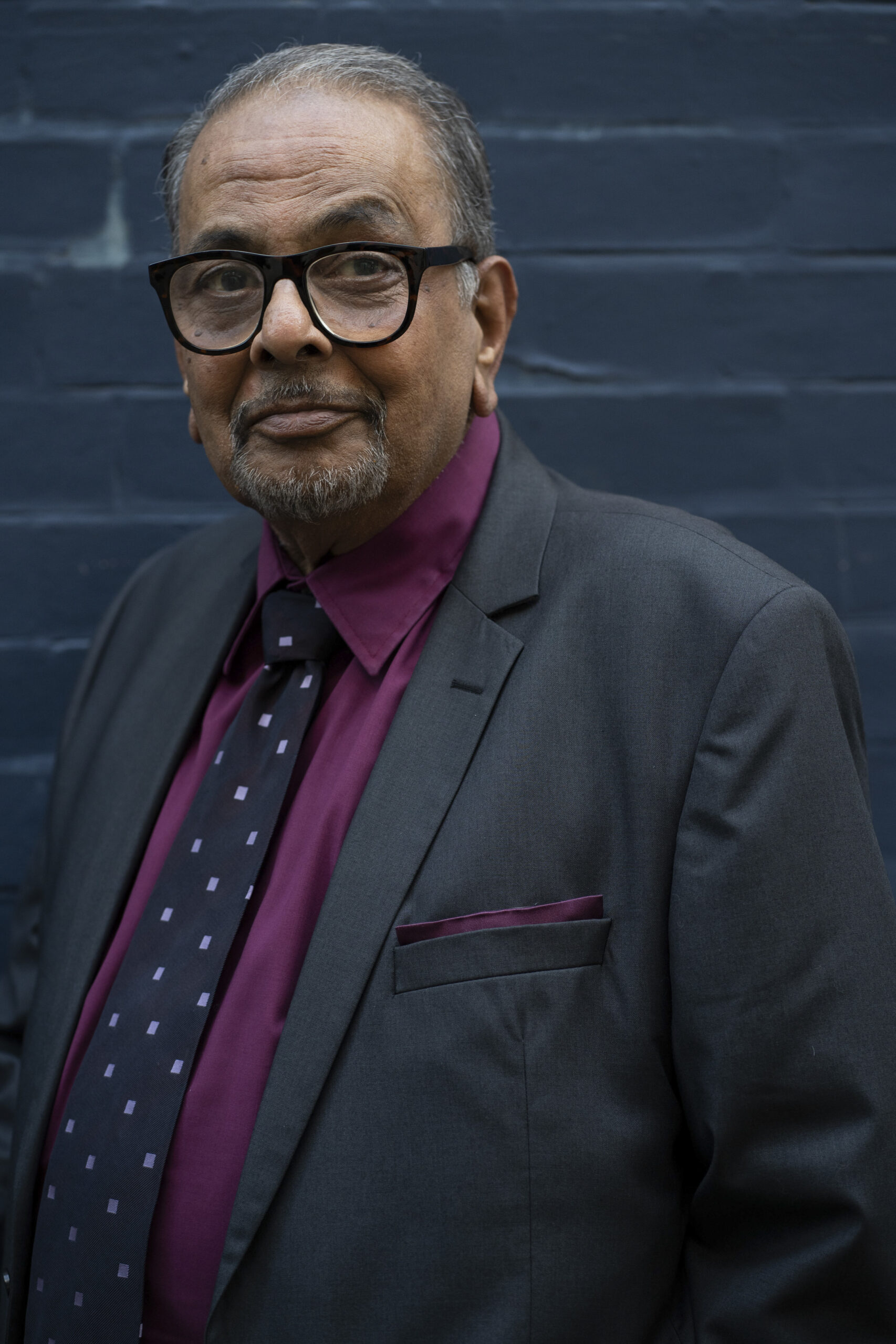 Dr Gupta stands outside his practice in Strike