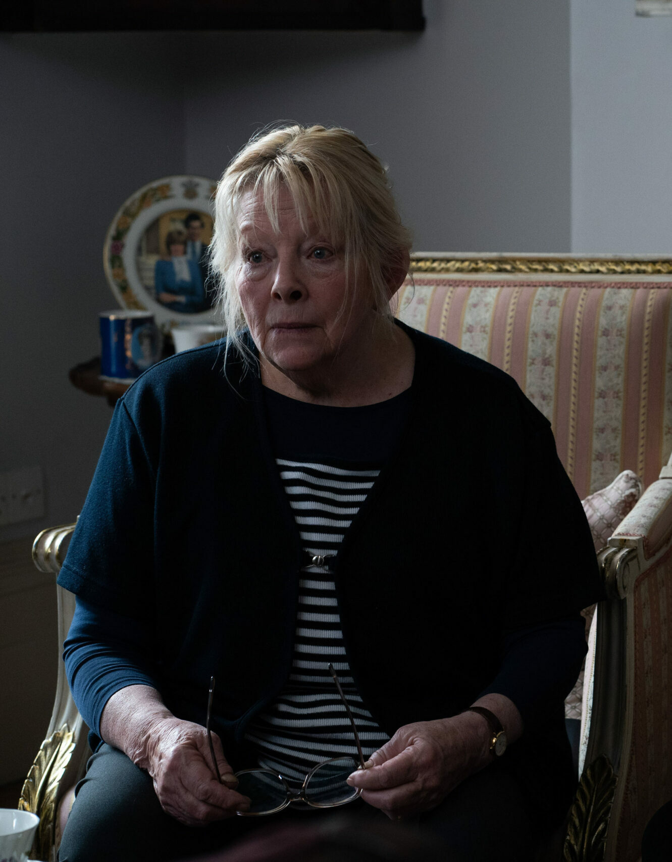 Janice Beattie speaks with Strike on a chair