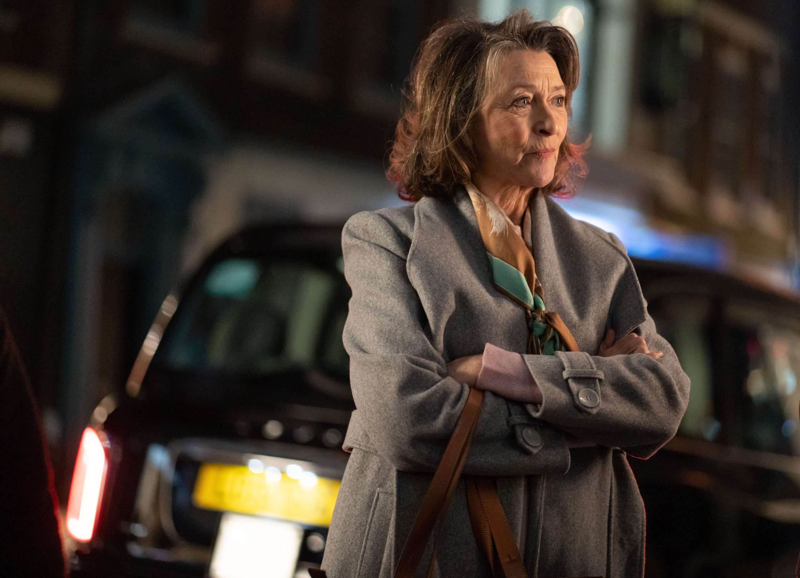 Gloria Conti stands outside in Strike Troubled Blood