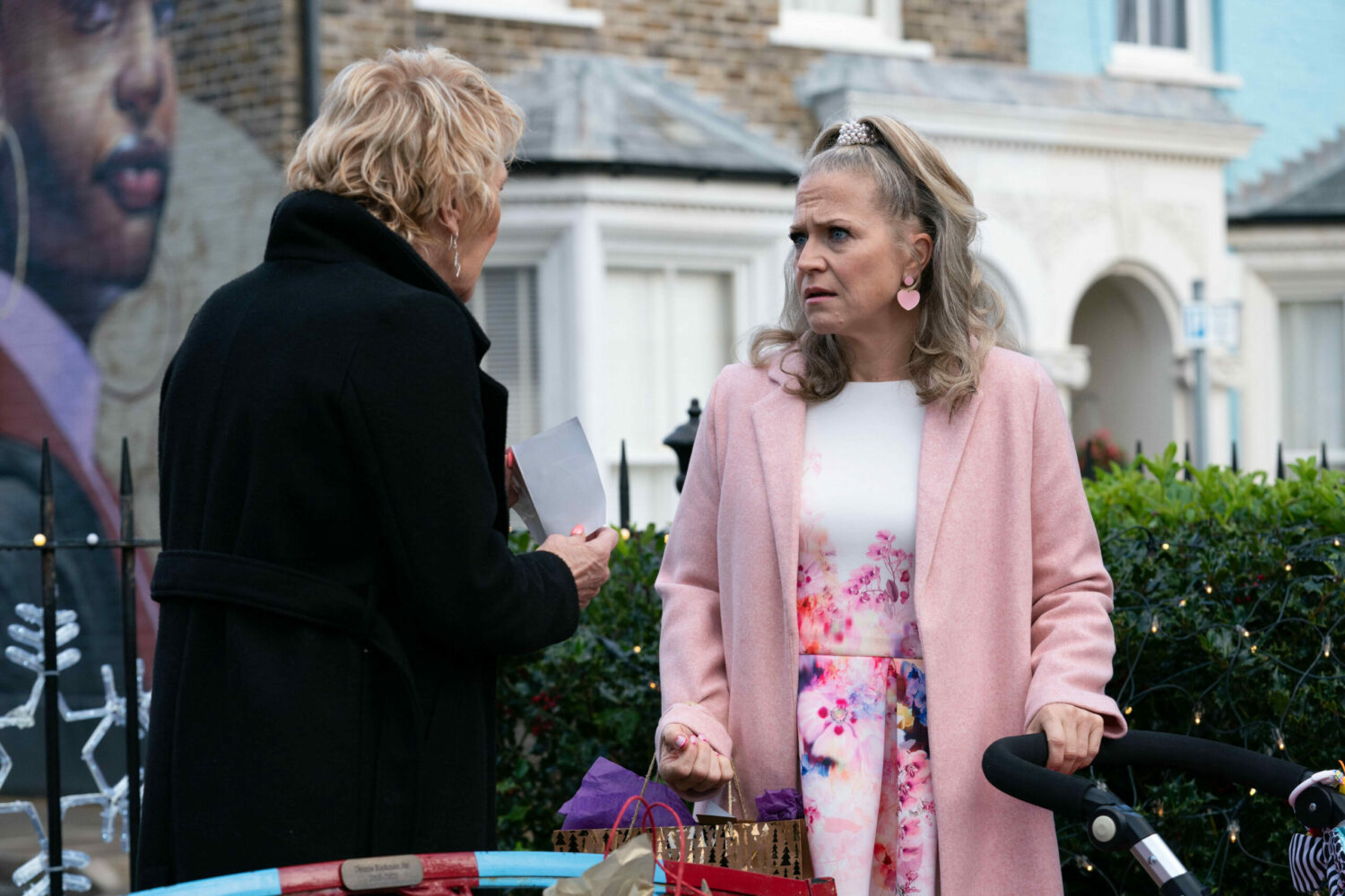 Linda looking worried at Shirley in EastEnders