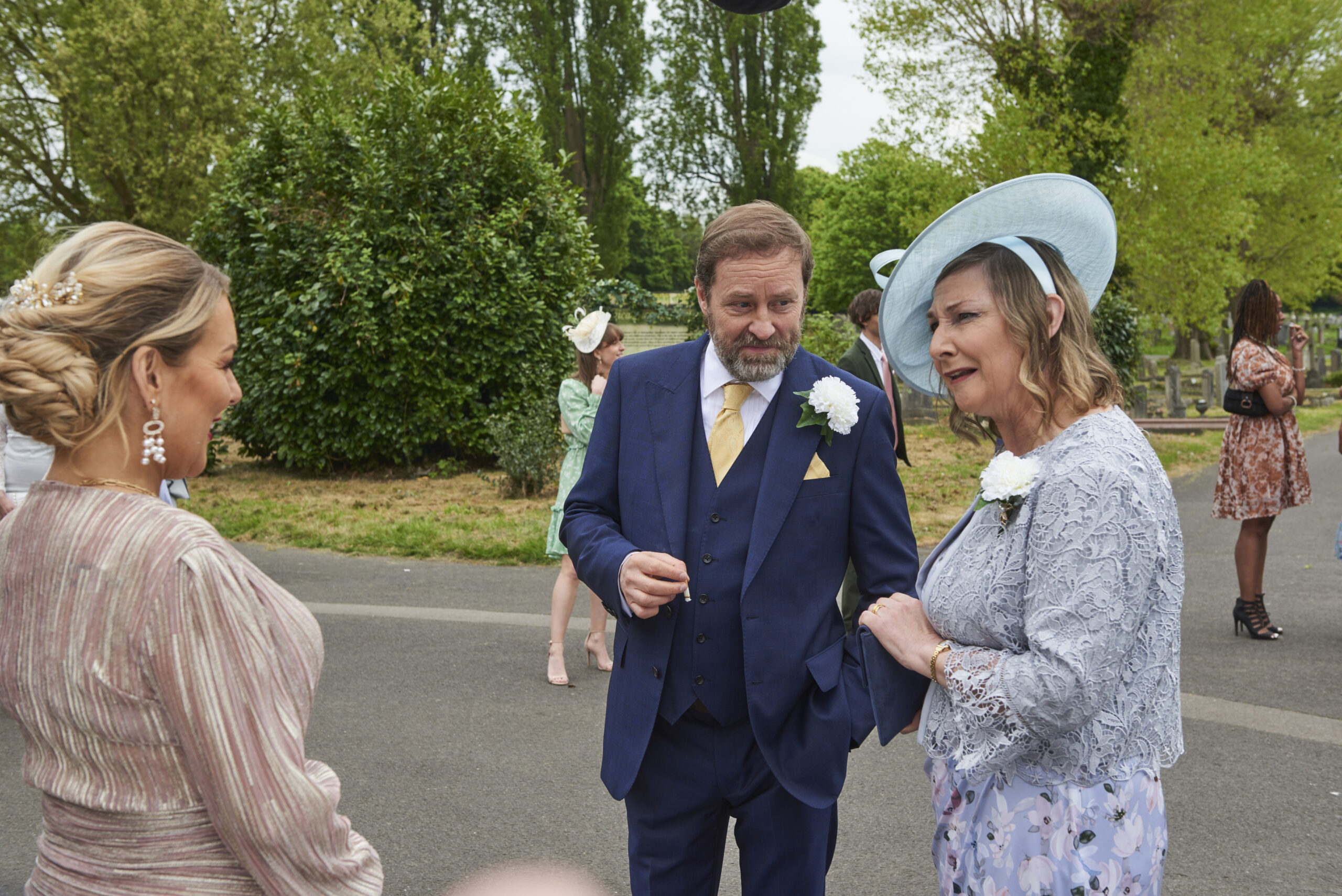 Conall and Win speak with Rosie Molloy at the wedding