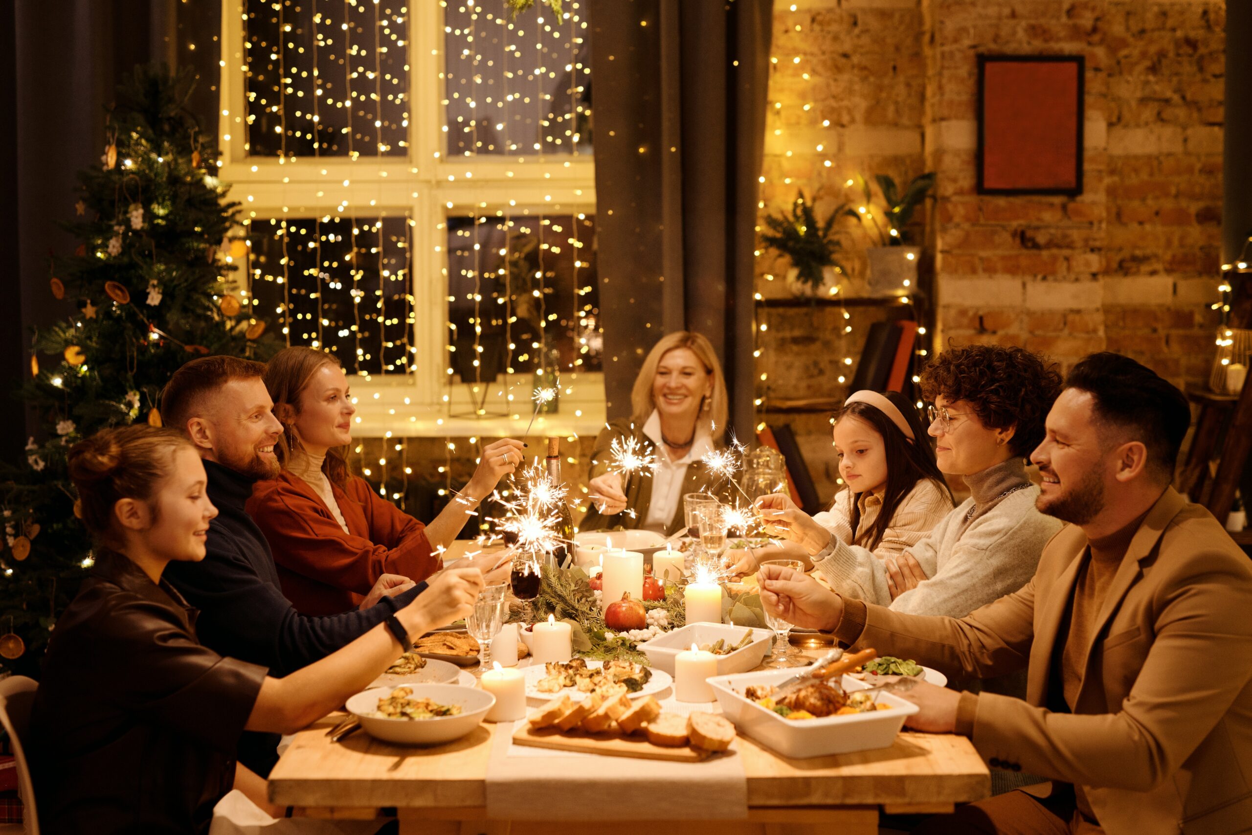Family sitting at a table having Christmas dinner