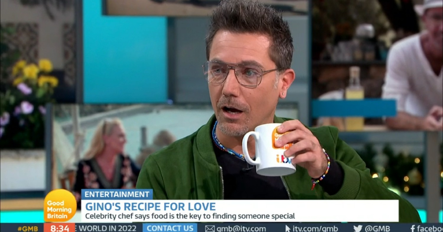 Gino D'Acampo holding a cup, looking shocked, on GMB today