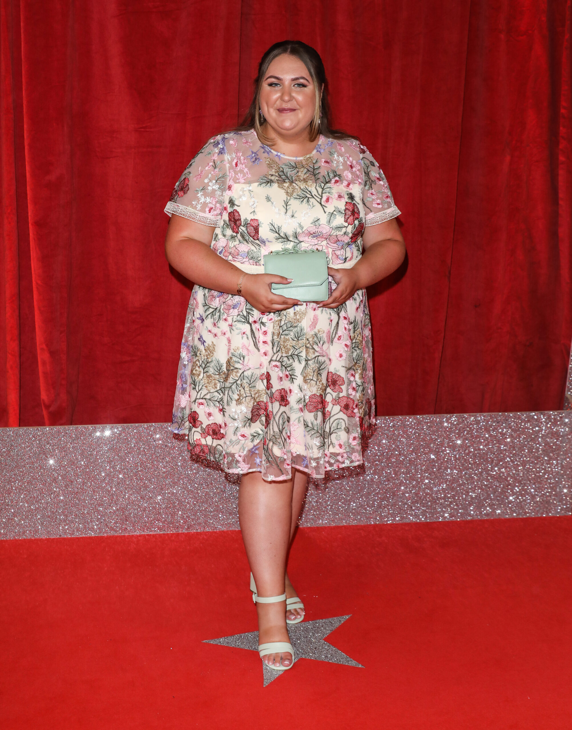 Clair Norris smiling on the red carpet of the British Soap Awards 2022