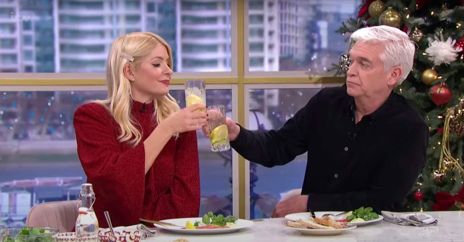 Holly and Phillip clink glasses on This Morning today