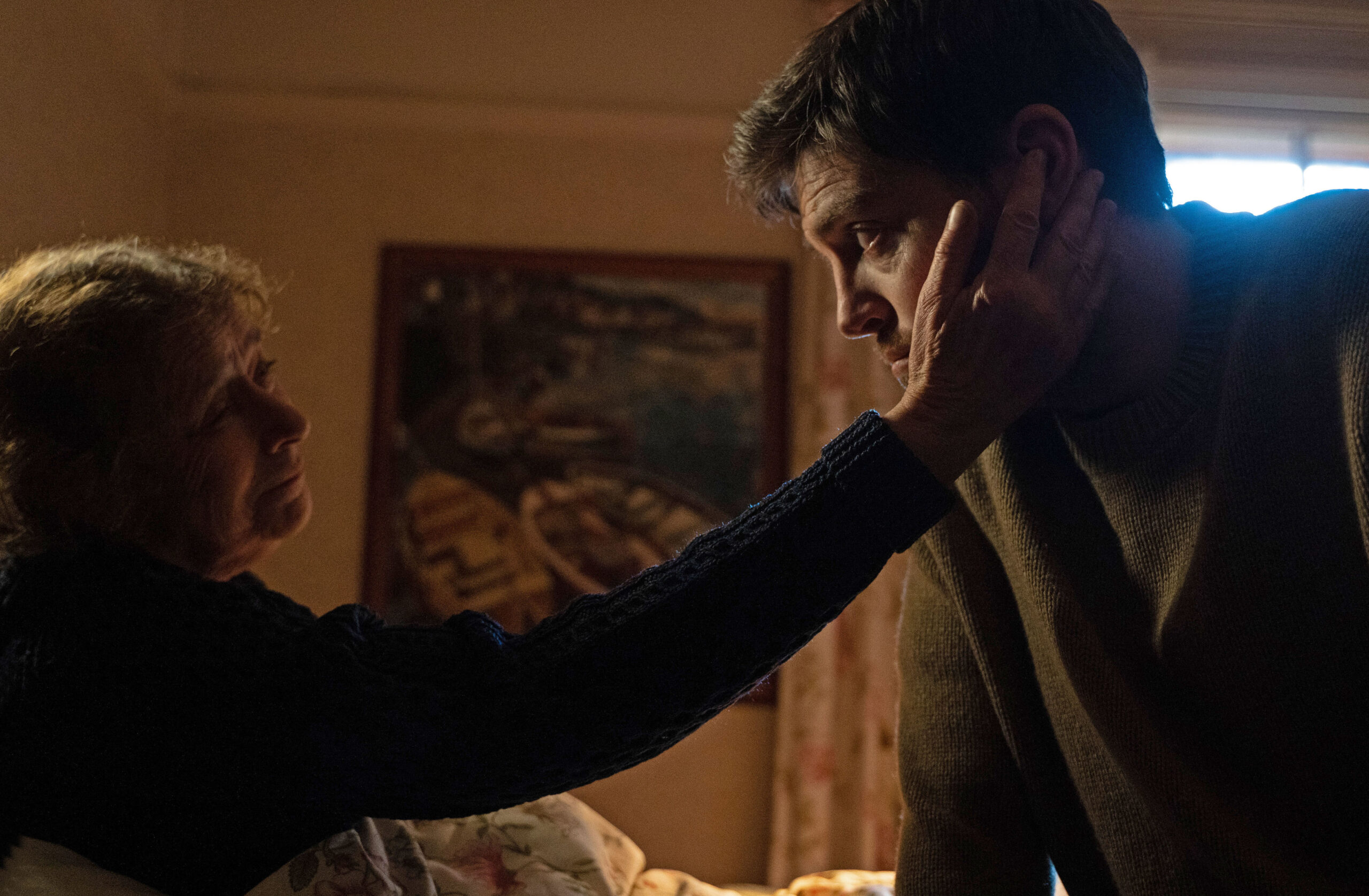 Joan holds Cormoran's face in Strike Troubled Blood episode 3