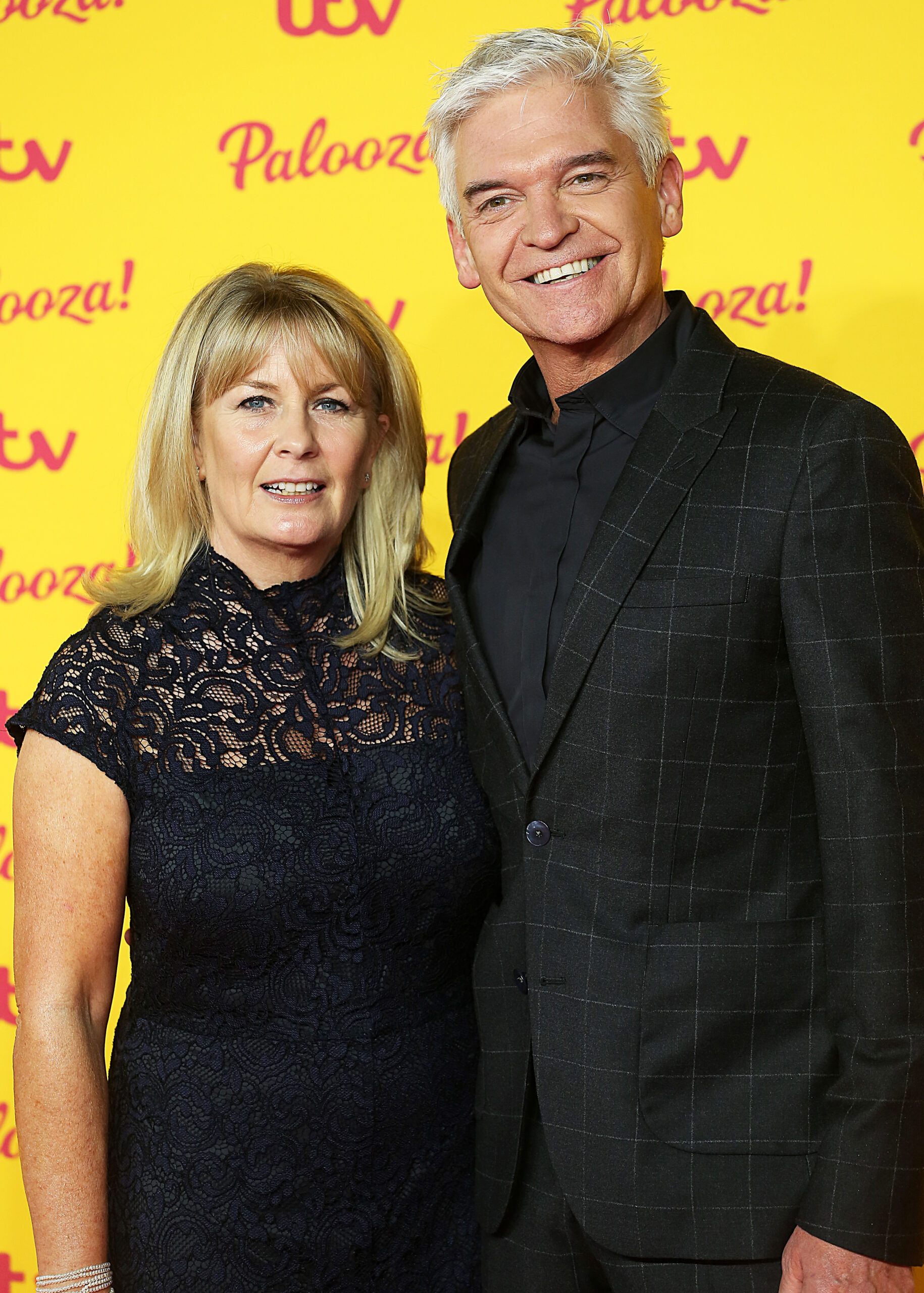 Phillip Schofield smiling with his wife