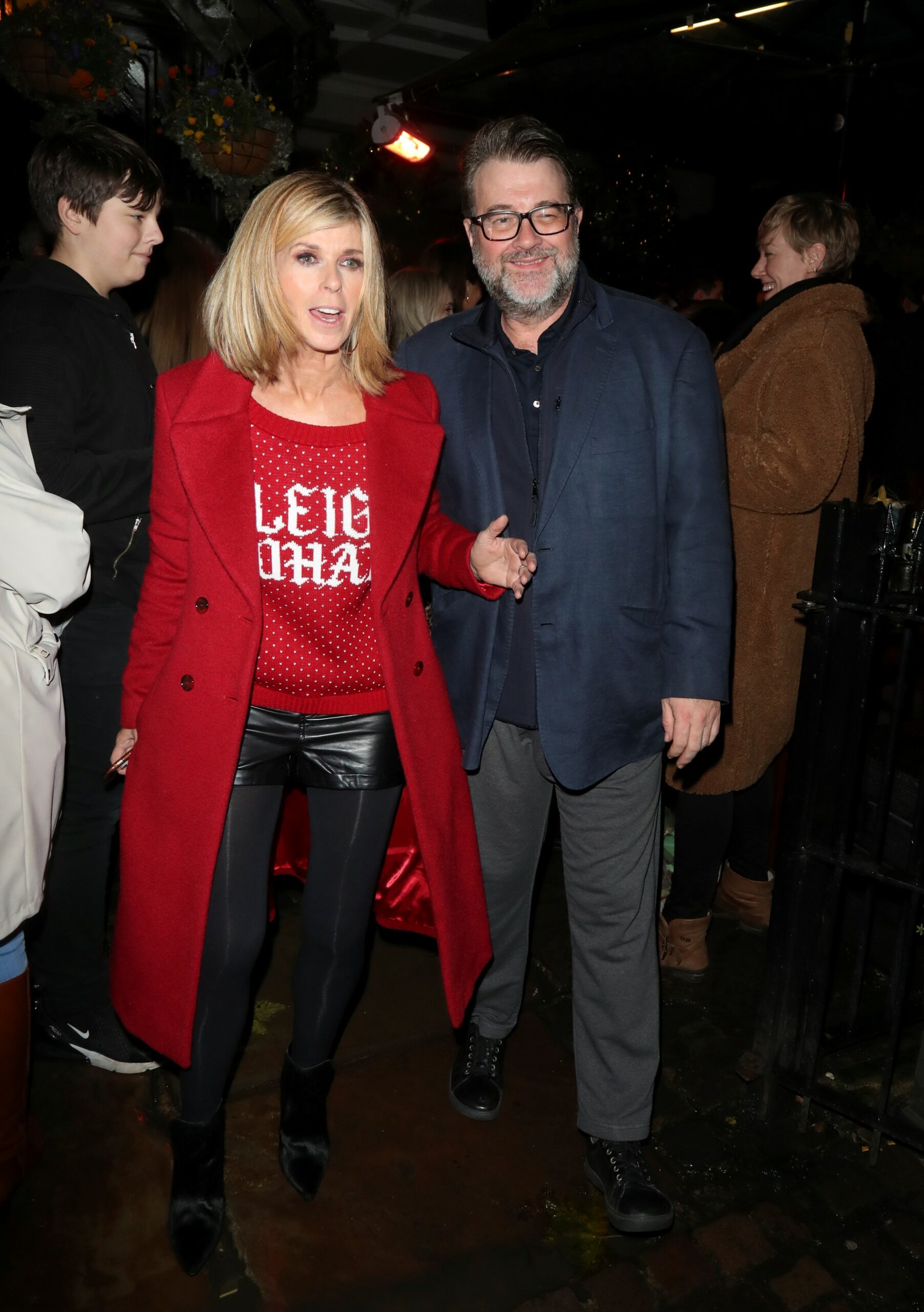 Kate Garraway smiling with husband Derek on night out