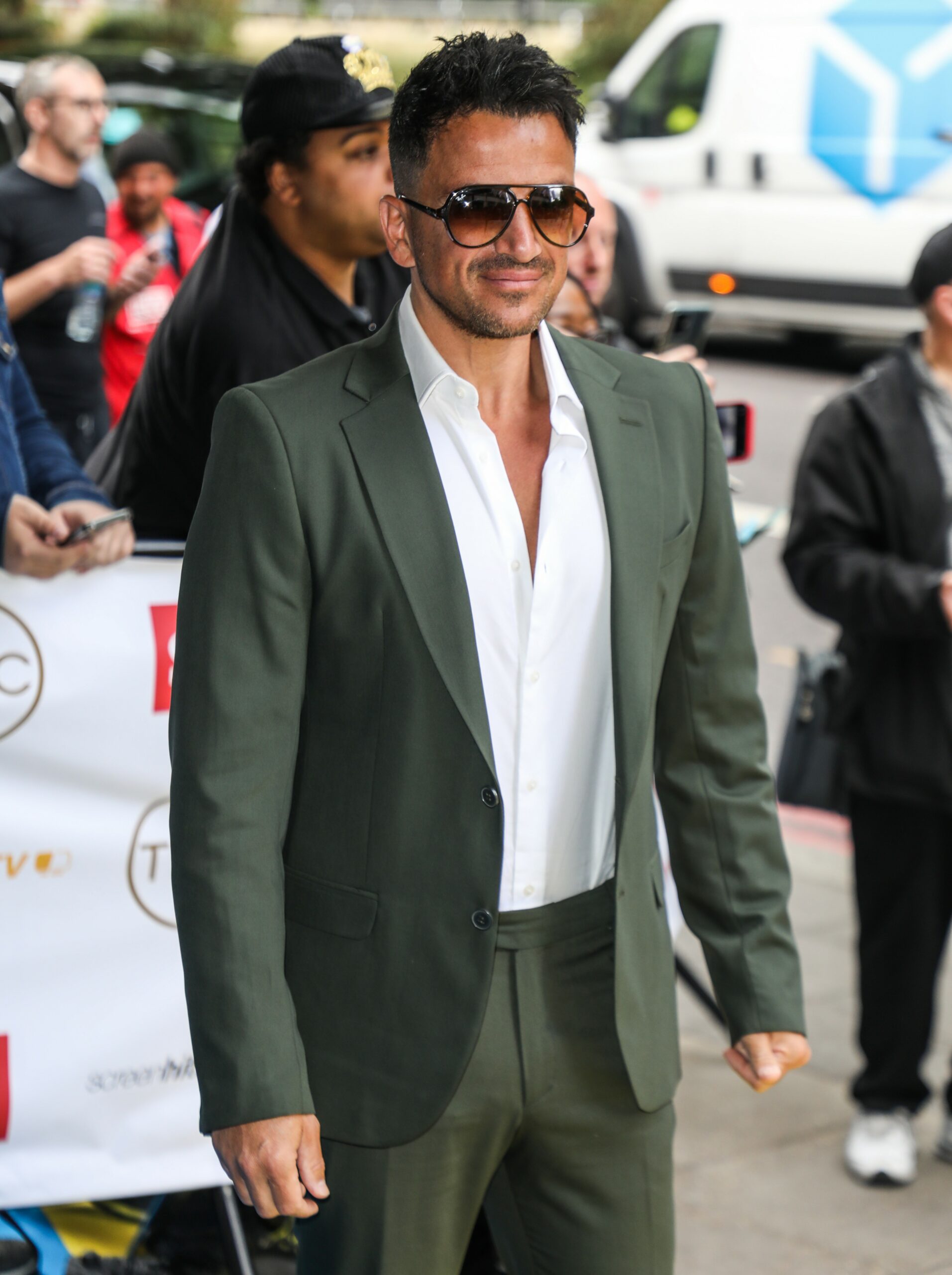 Peter Andre in grey suit and sunglasses at TRIC Awards