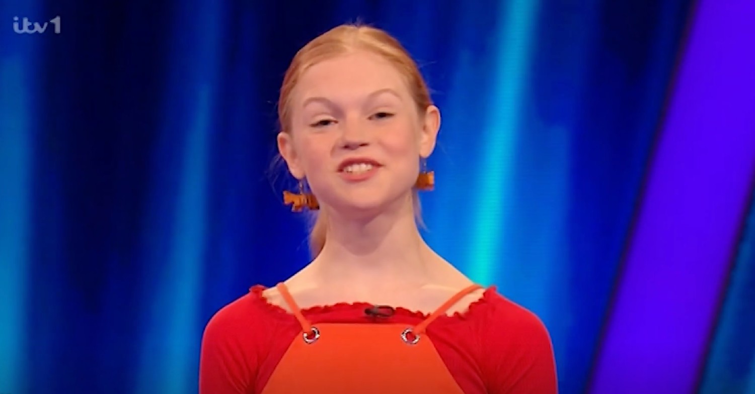 Joni speaking to camera on game show Tipping Point 