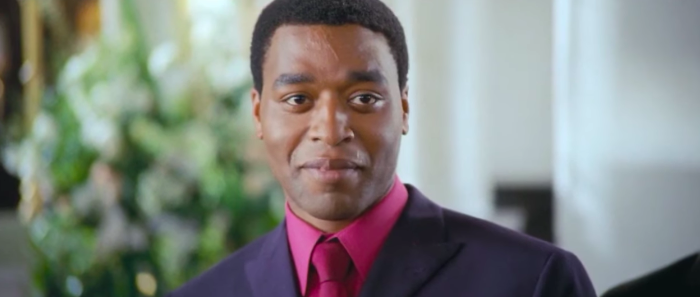 Love Actually character Peter smiling at the altar