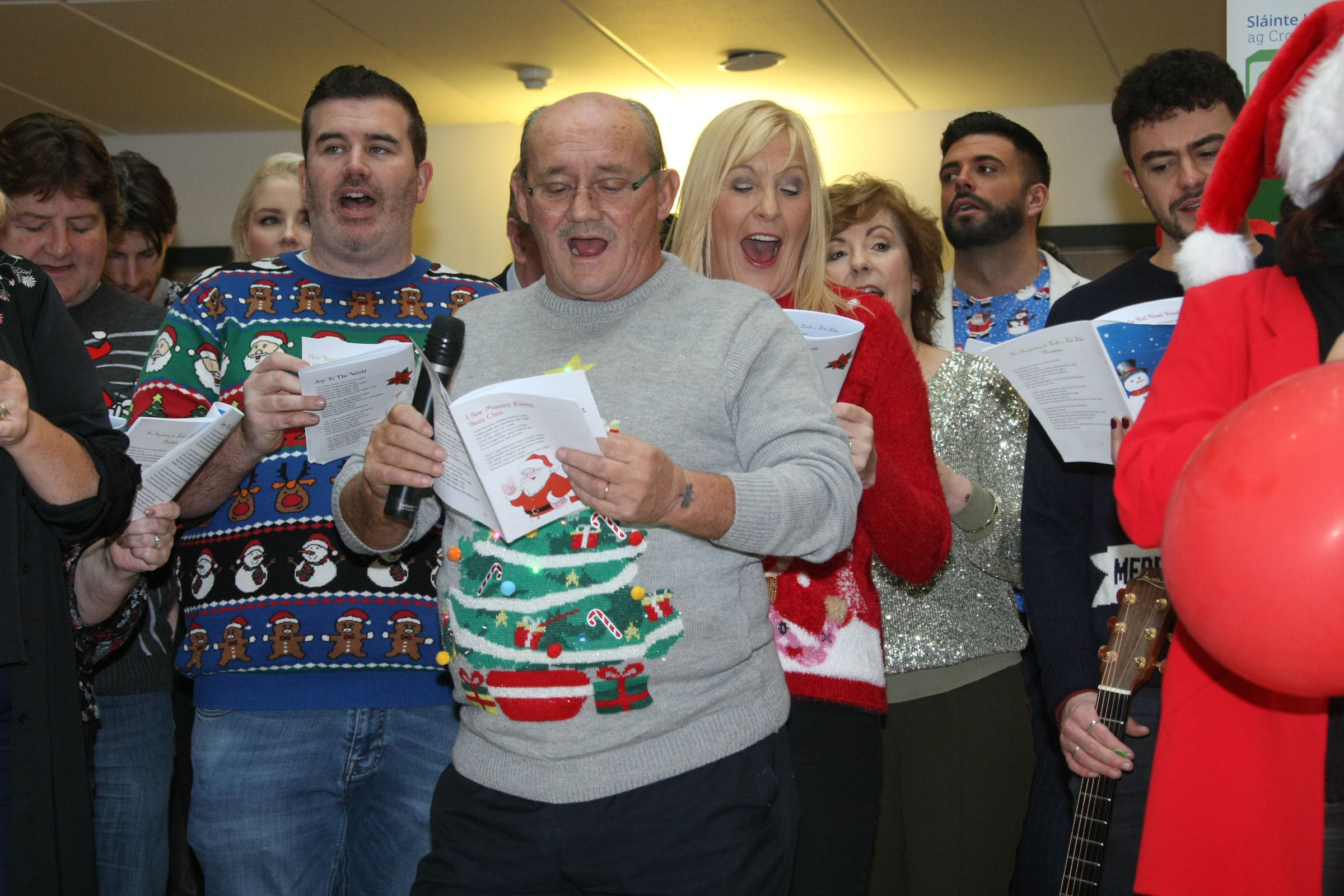 Cast of Mrs Brown's Boys in Christmas jumpers singing