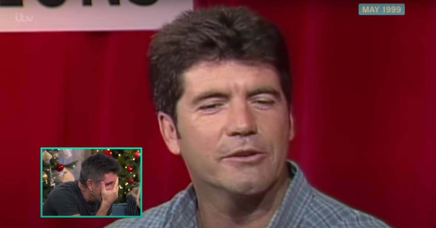 Simon Cowell covers his face in embarrassment