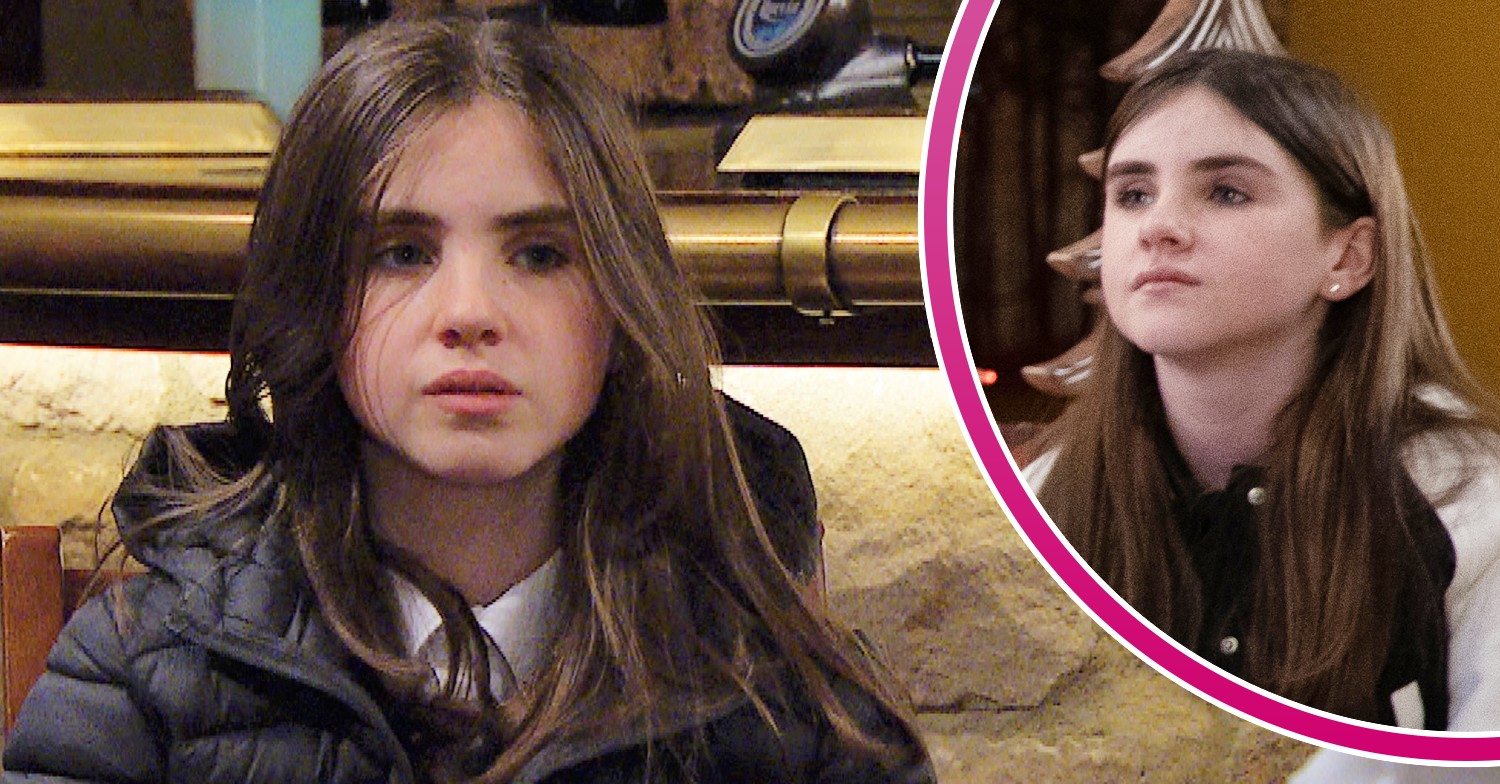 April Windsor looking worried and smug in Emmerdale