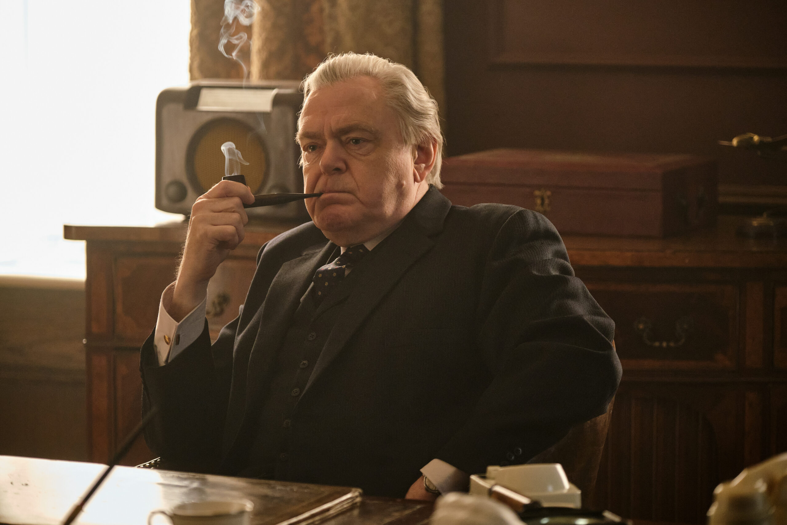 Harold Wilson smokes a pipe in Stonehouse