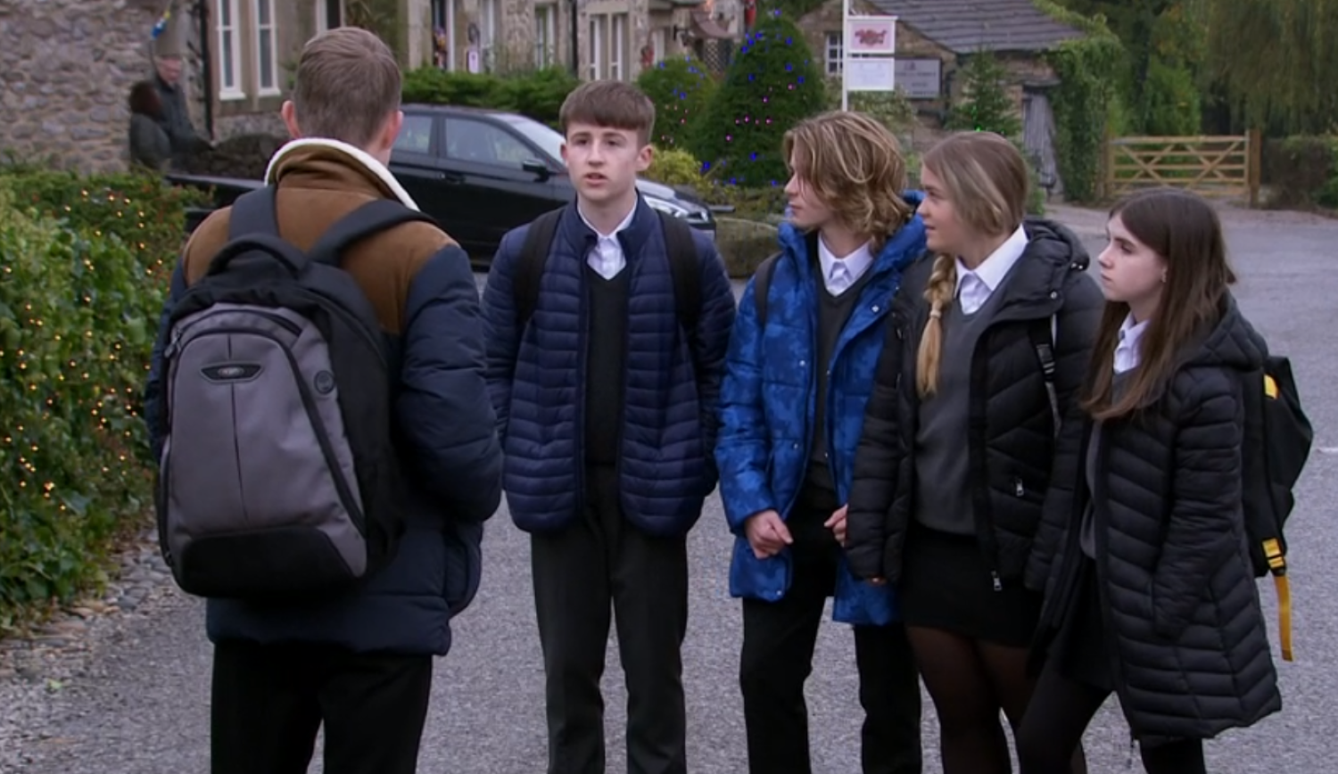 Arthur, Elliot, Heath, Cathy and April all talk in Emmerdale village