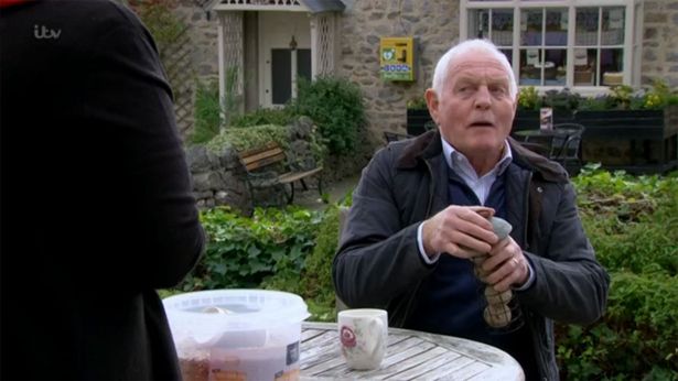 Eric Pollard looking shocked on Emmerdale (Credit: ITV) 