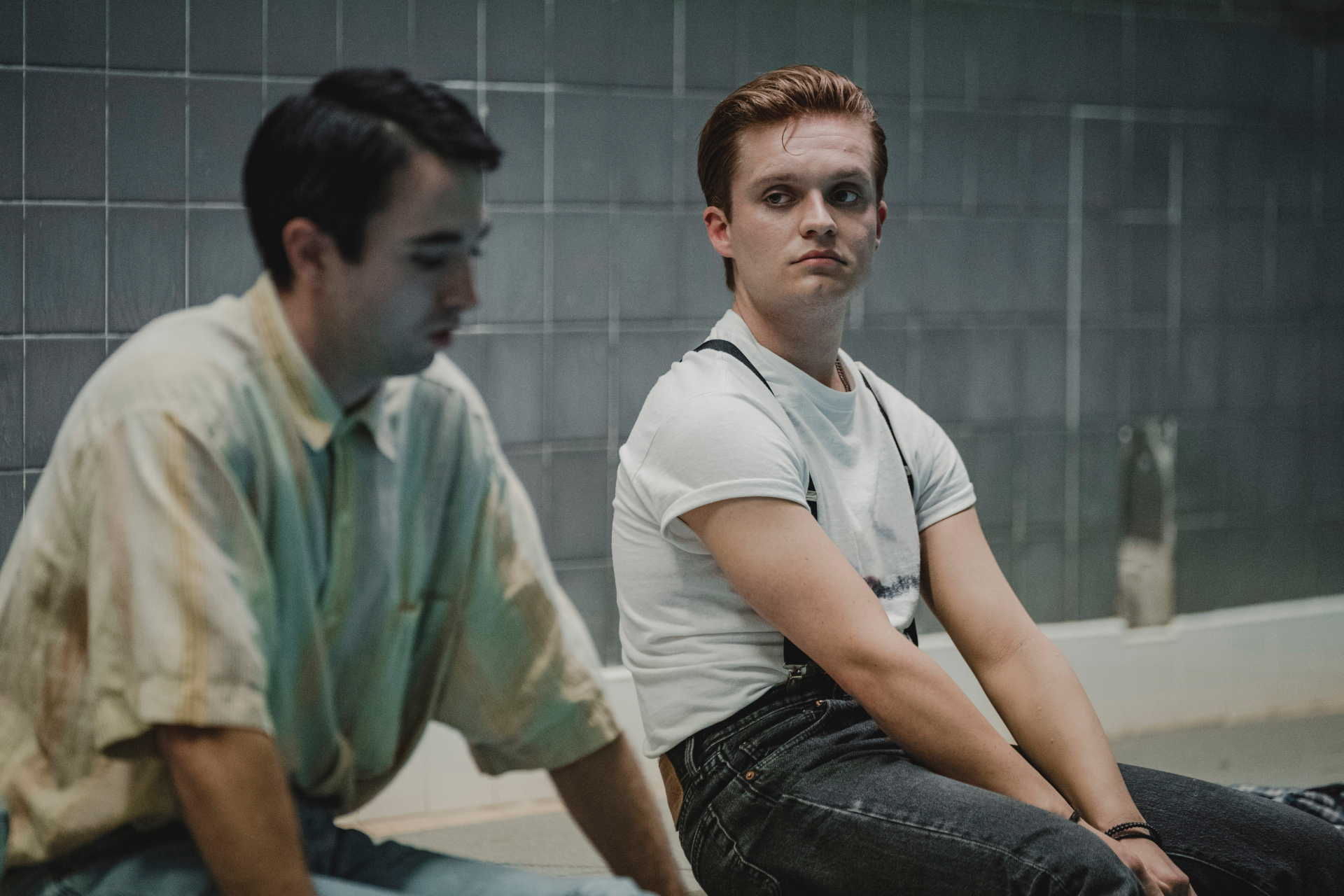 Rian Gordon and Tom Glynn-Carney sitting by the pool in Mayflies