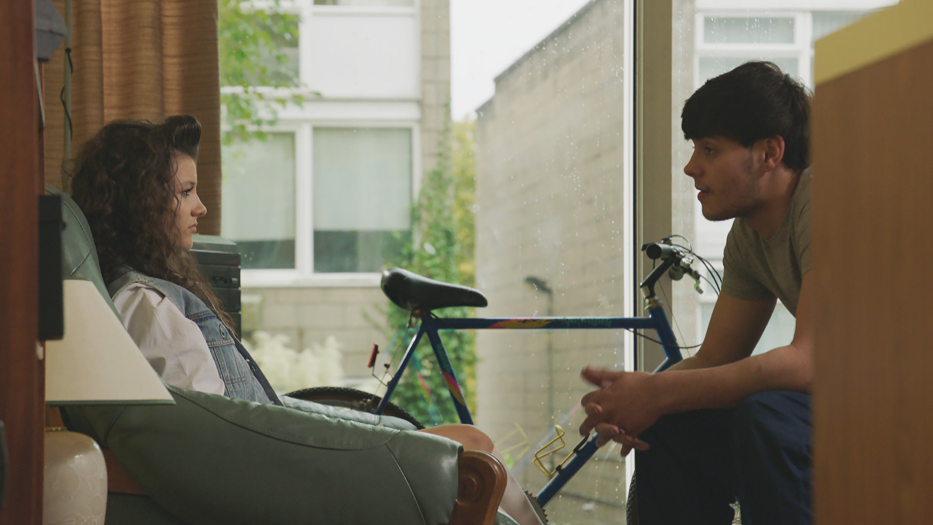 Maddy Barker sitting with Aiden Kane in Emmerdale